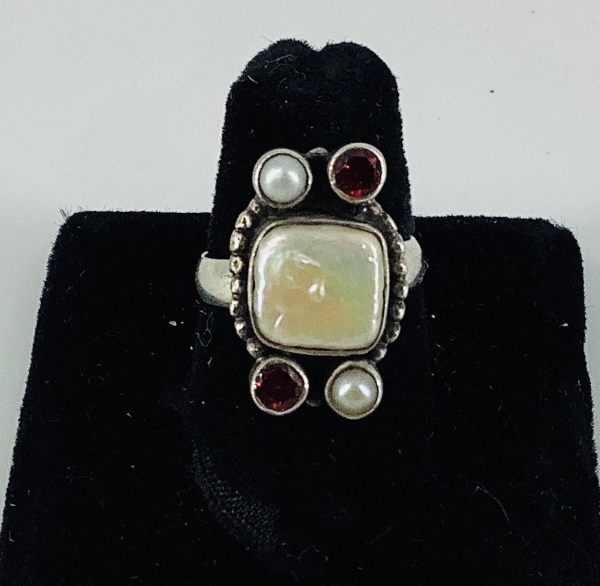 Sterling Silver Ring: Sterling Silver Ring Stamped and tested 925/sterling silver, 0.23 troy ounces total weight, size 6.5, wide mount with pearls and garnet stones measuring up to 9.5mm in width, mounting approx. 22.25mm 