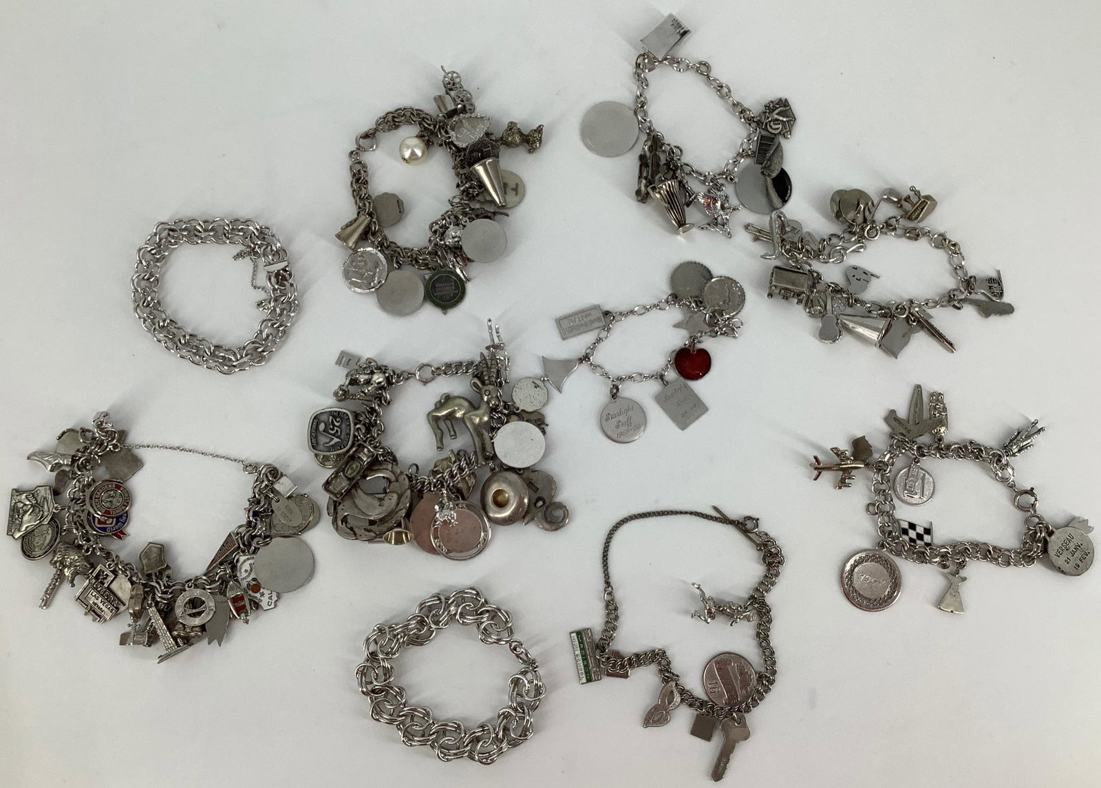 Silver Charm Bracelets with Charms: Silver Charm Bracelets with Charms Some silver content in bracelets (not sterling/amount varies/some stamped sterling incorrectly) (tested) with sterling silver and silver tone metal charms (mostly si