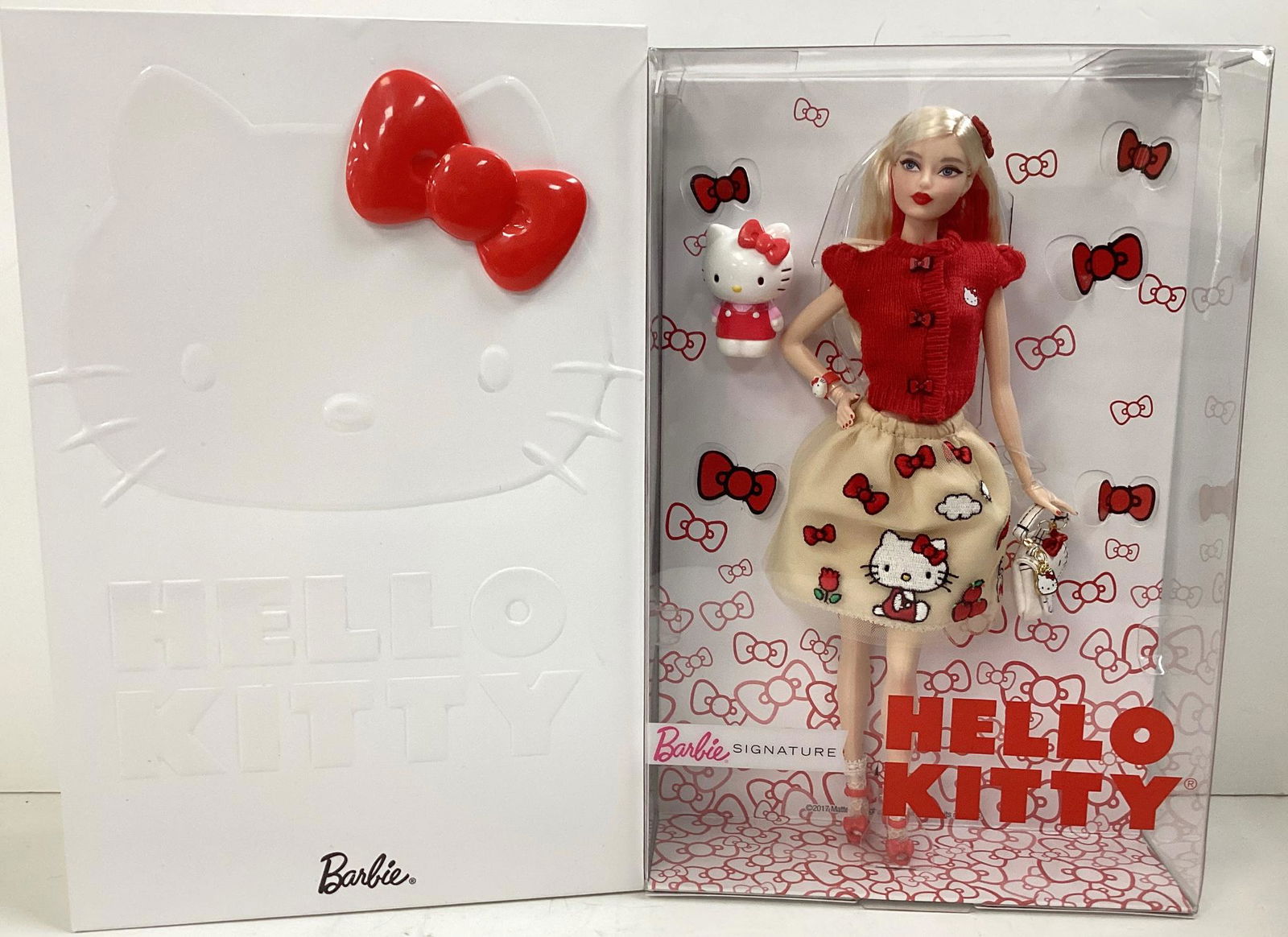 (1) Hello Kitty Barbie from Barbie Signature Gold Label with no more than 20,000 worldwide. Hello: (1) Hello Kitty Barbie from Barbie Signature Gold Label with no more than 20,000 worldwide. Hello Kitty Barbie is in a super cute red sweater w/ Hello Kitty on it & Tan skirt decorated in red bows & H