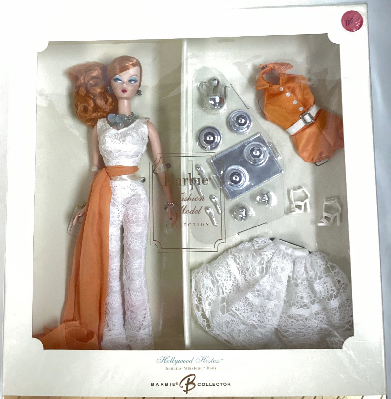 (1)Hollywood Hostess Silkstone Barbie as a part of the BFMC.- Gold Label with no more than 7,800: (1)Hollywood Hostess Silkstone Barbie as a part of the BFMC.- Gold Label with no more than 7,800 worldwide - Red haired Barbie pulled to the side, white lacy & orange hostess outfit and comes with ano
