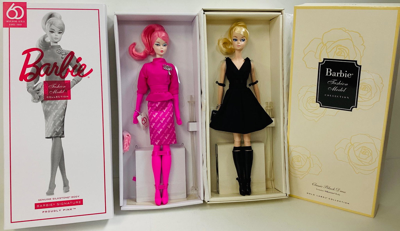(2) BFMC Barbies with Silkstone bodies including (1) Proudly Pink Barbie, a gorgeous Barbie dressed: (2) BFMC Barbies with Silkstone bodies including (1) Proudly Pink Barbie, a gorgeous Barbie dressed in all pink, including her hair, a Barbie pin on her sweater and Barbie logo wrote all over her skir