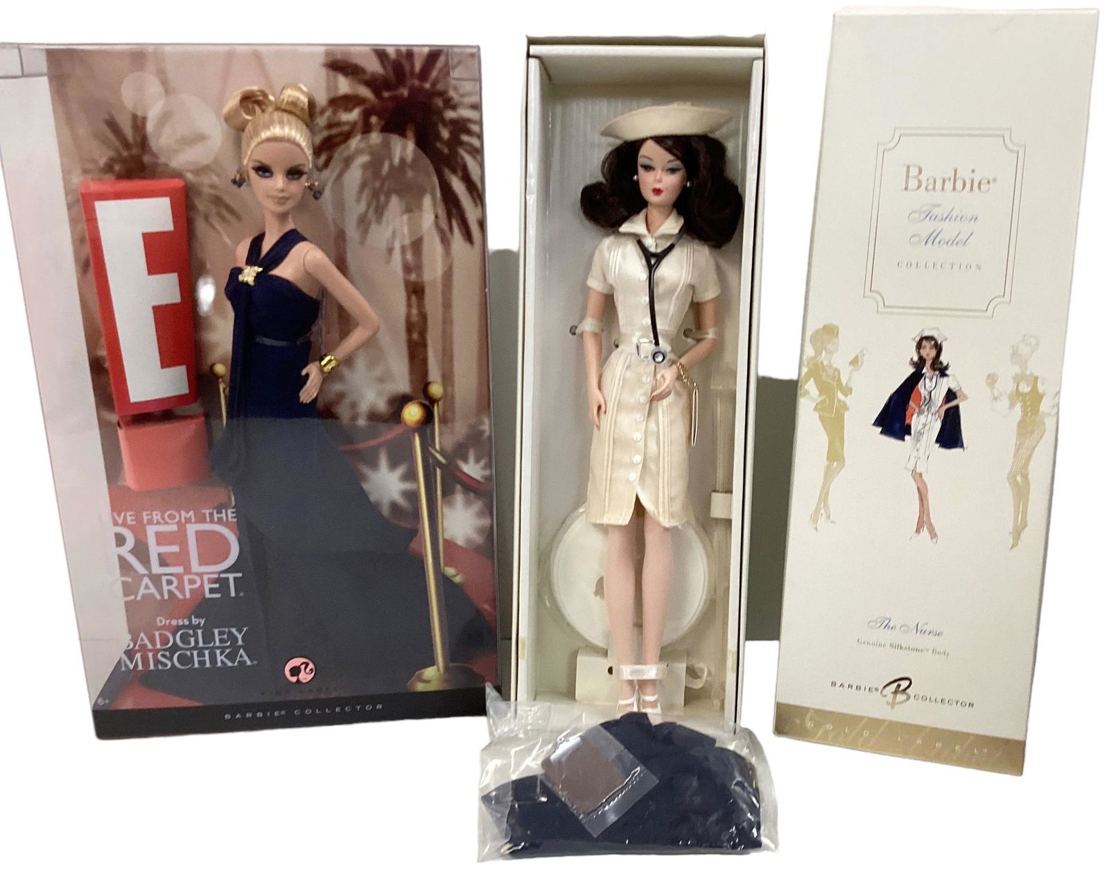 (2) Barbies including (1) BFMC 'The Nurse' Barbie with a silkstone body and inside the box you will: (2) Barbies including (1) BFMC 'The Nurse' Barbie with a silkstone body and inside the box you will see Barbie as a nurse with many accessories. 'The Nurse' Barbie is a VHTF doll and she is a gorgeous