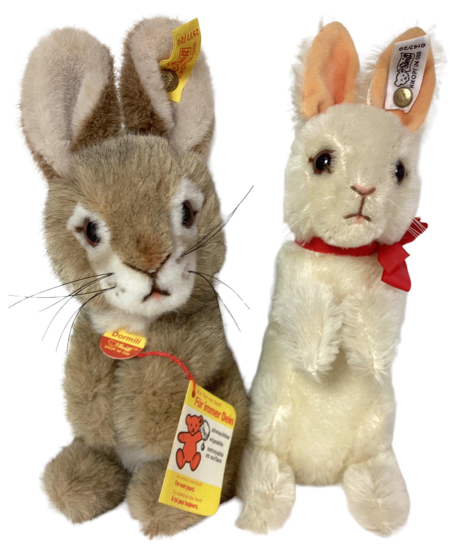 (2) Steiff Rabbits. Includes 9" plush unjointed Dormili and 9 1/2" white mohair rabbit jointed at (1 of 3)