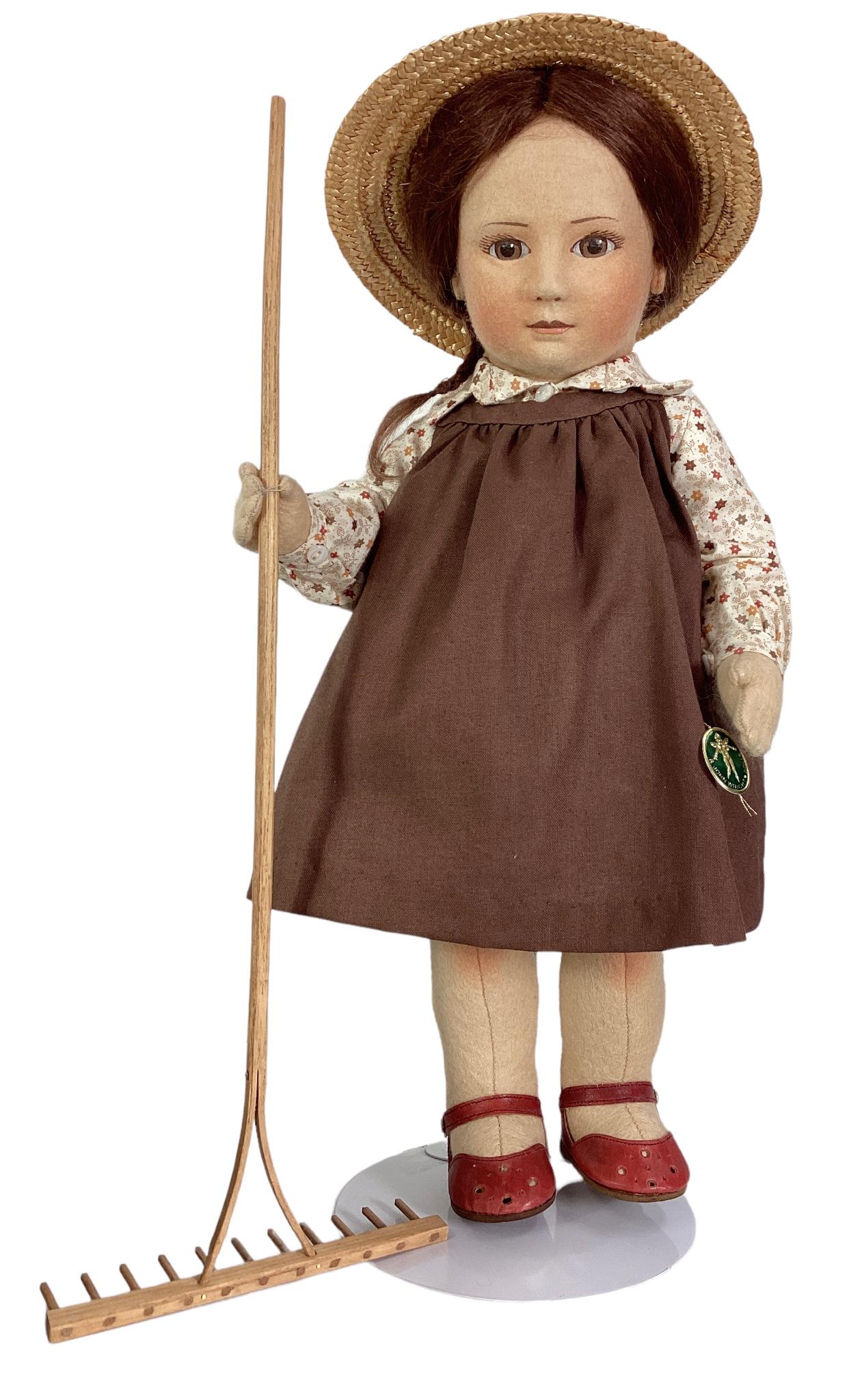 R.John Wright Dolls Little Children Series I "Becky" with rake, #75/250, tag sewn on dress, with: R.John Wright Dolls Little Children Series I "Becky" with rake, #75/250, tag sewn on dress, with stand and original box.