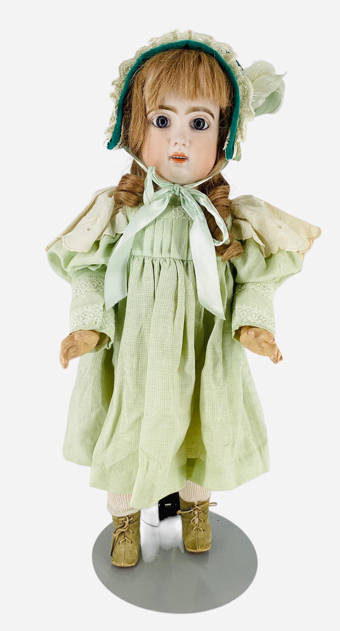 Jumeau bisque socket head girl marked "9" as shown.. 22 1/2" doll with replaced human hair wig,: Jumeau bisque socket head girl marked "9" as shown.. 22 1/2" doll with replaced human hair wig, stationary glass eyes, pierced ears, open mouth with teeth, on jointed composition body stamped "Jumeau"