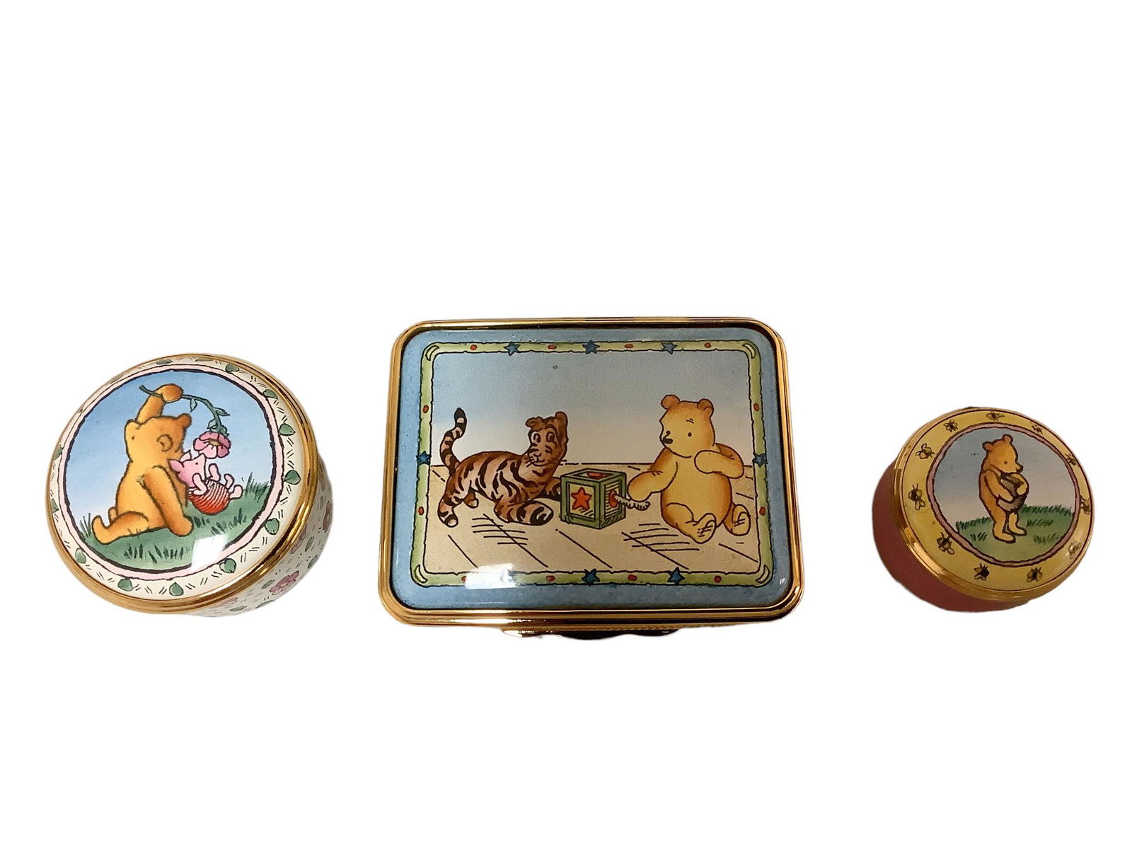 Lot of three Halcyon Days enameled trinket boxes, one with hinged lid, two with twist off lids, all (1 of 2)