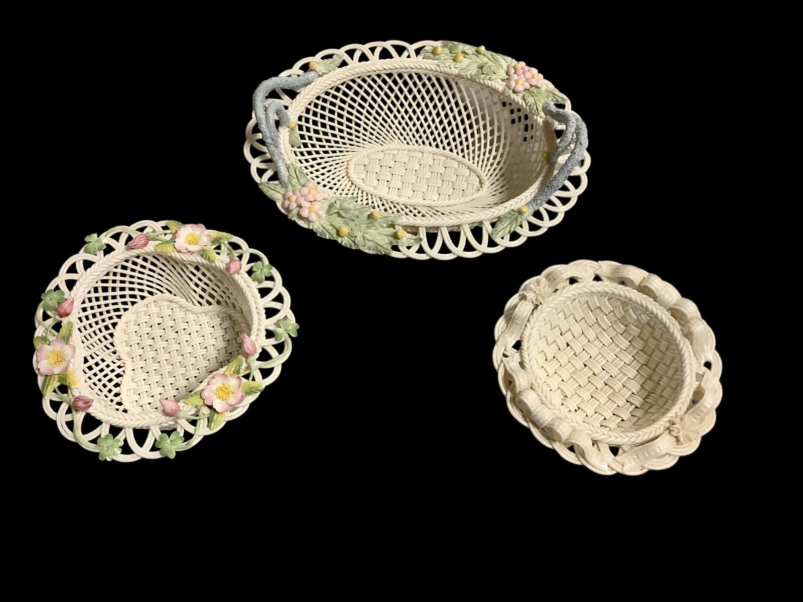 Lot of 3 Belleek hand woven china strand baskets with floral rims. Baskets include 9" oval "Henshall (1 of 2)