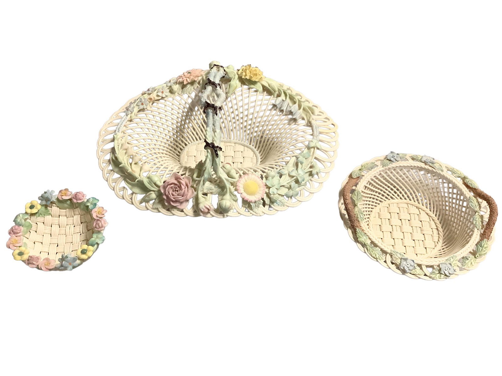 Lot of three pieces of Belleek including an 11"L oval basket with handle, a 6.25" diameter basket: Lot of three pieces of Belleek including an 11"L oval basket with handle, a 6.25" diameter basket and a 3.75" diameter basket