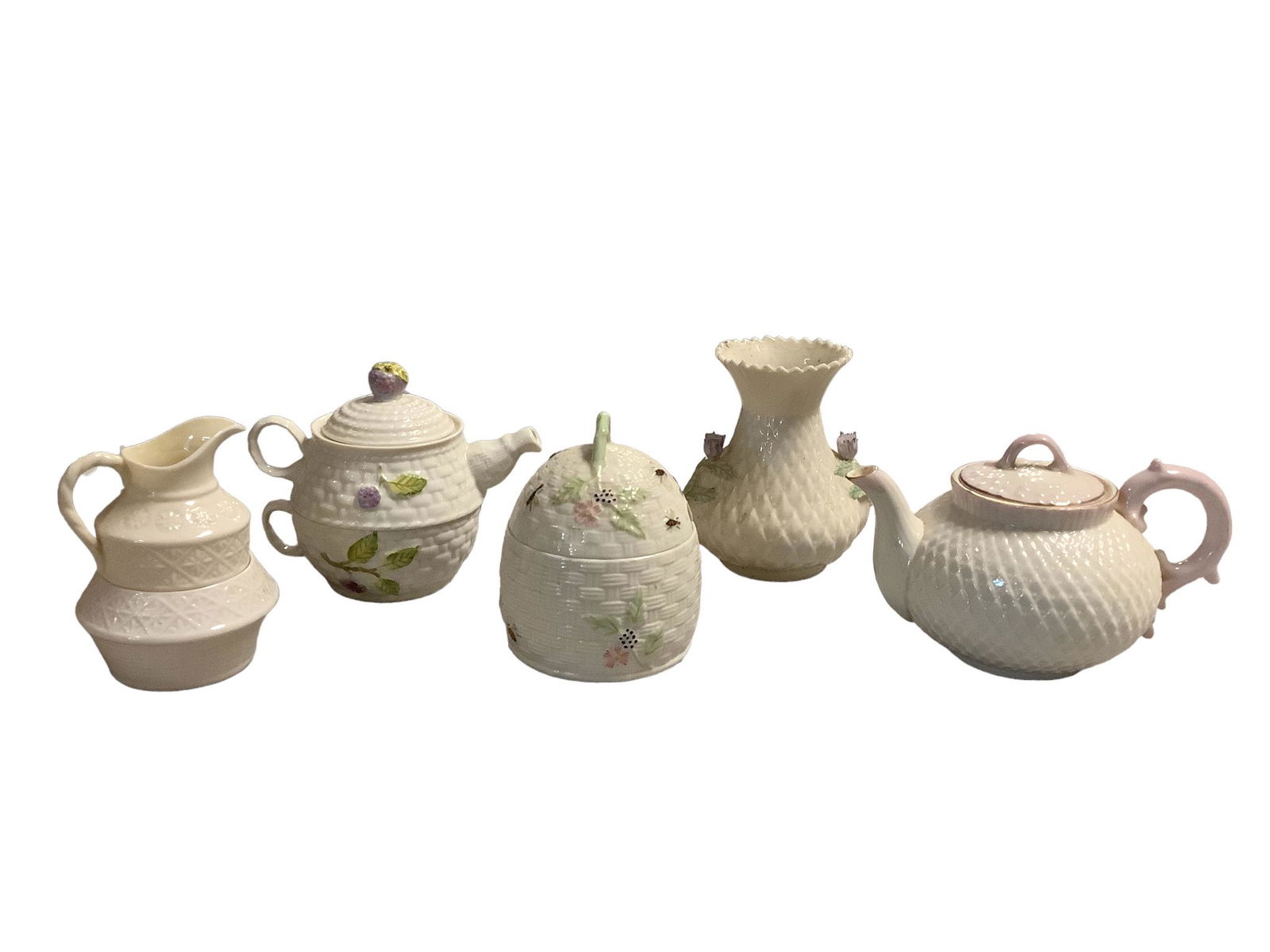Lot of five pieces of Belleek including a 5"h honey pot, a 5.25"h vase, a Berry tea-4-one teapot, a (1 of 3)