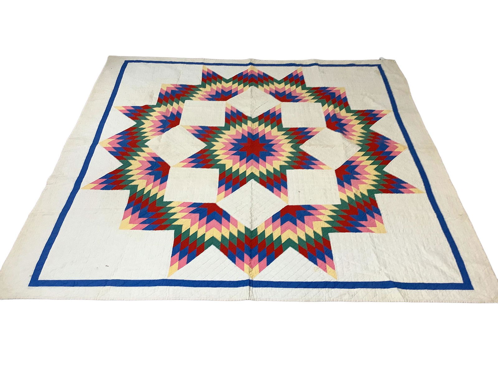 Multicolored Star quilt measuring 75" x 77". Some staining on back & from. (1 of 3)