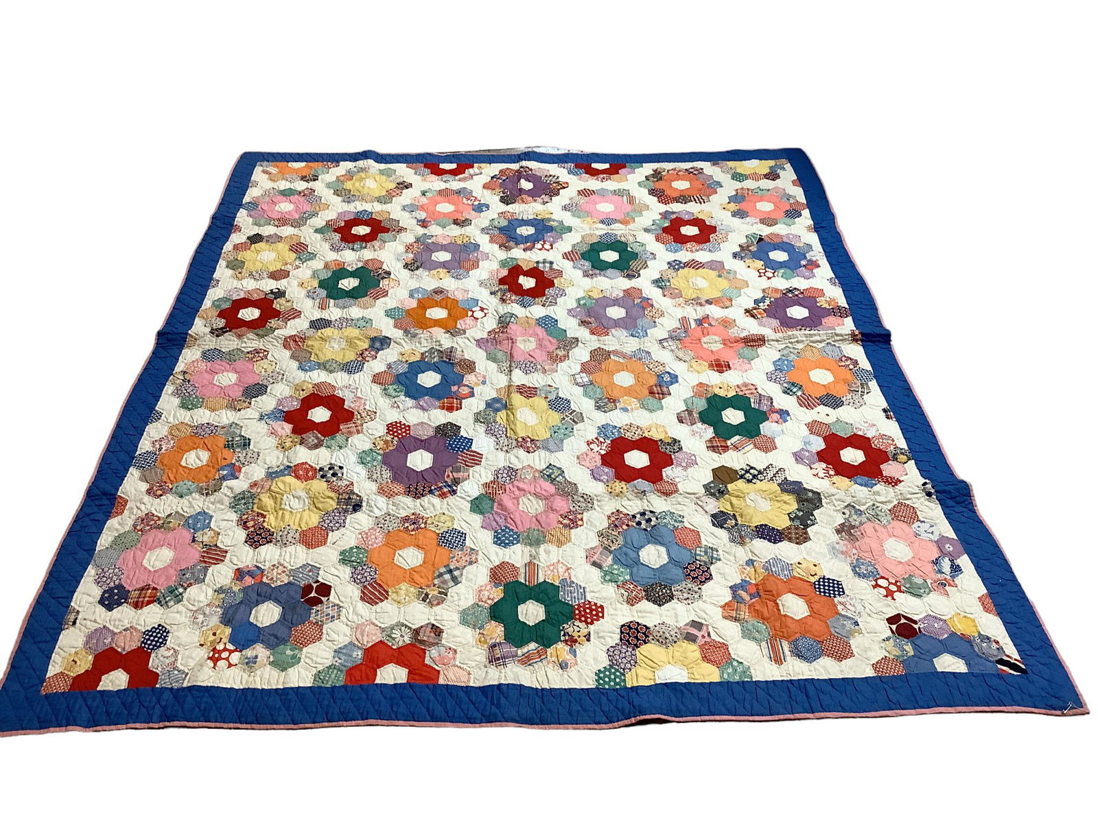 Brightly colored quilt measuring 72" x 84". Some staining.: Brightly colored quilt measuring 72" x 84". Some staining.