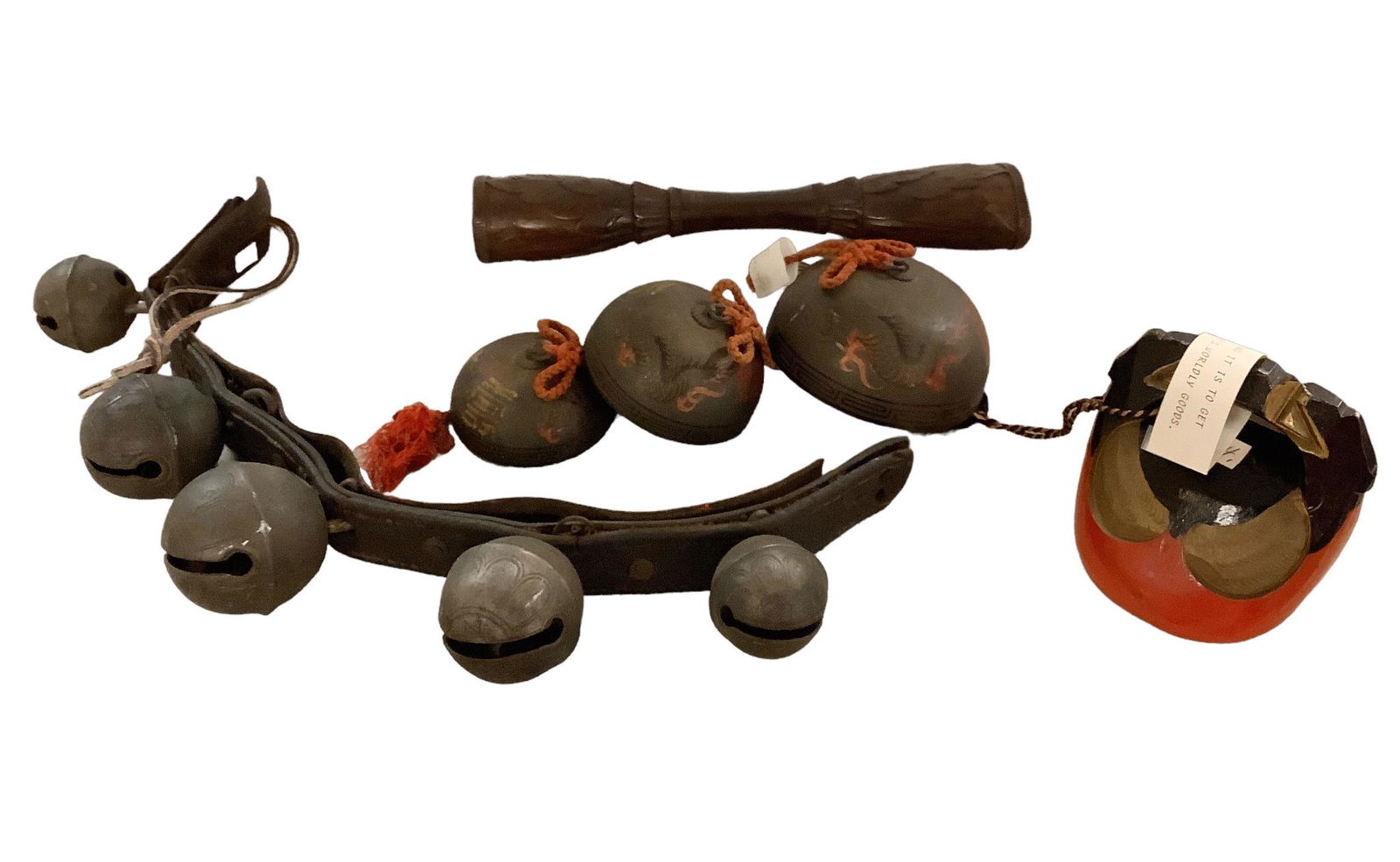 Lot of 4. Painted Chinese gong chimes - 3 bells 4.5-inches to 3-inches. 4-inch painted Chinese Block: Lot of 4. Painted Chinese gong chimes - 3 bells 4.5-inches to 3-inches. 4-inch painted Chinese Block bell. 12-inch carved wooden rattle from Bali. 20- inch leather strap of 5 sleigh bells.