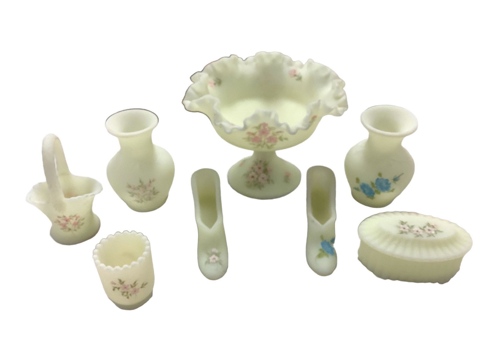 Lot of eight pieces of vintage Fenton hand painted custard glass including a 5.75"h compote, two: Lot of eight pieces of vintage Fenton hand painted custard glass including a 5.75"h compote, two 4.5" vases, a trinket box, two shoes, a basket and a toothpick holder. No chips.