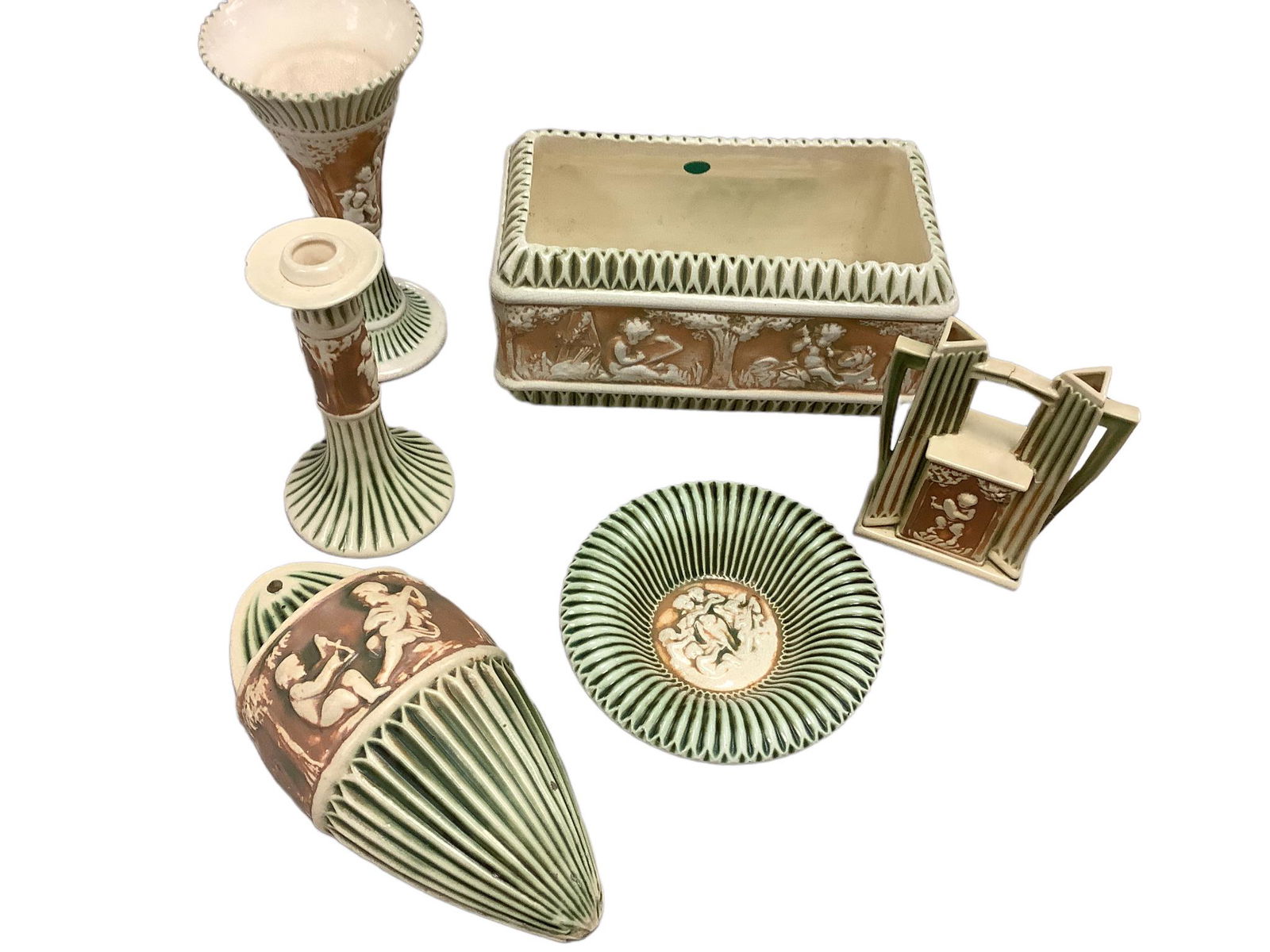 Damaged Roseville Donatello pattern of cherubs amidst the trees. Cream/Green/Tan. There are 6 items (1 of 11)