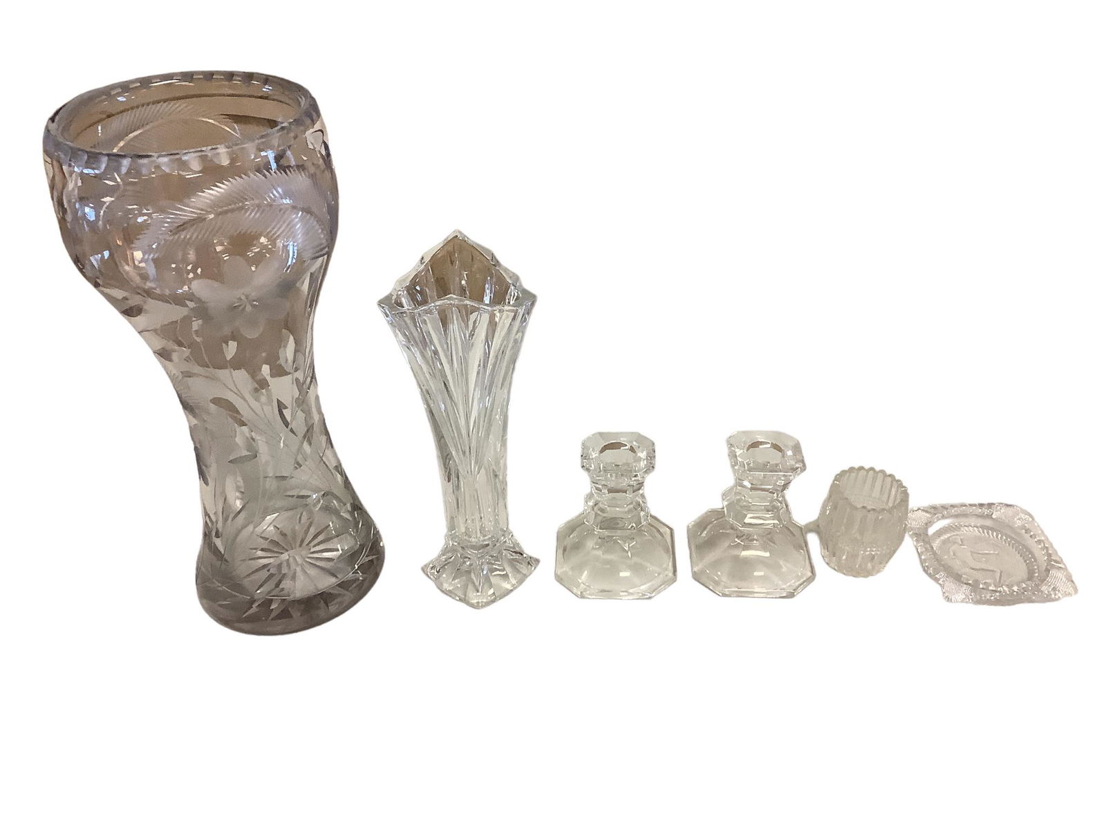 Lot of clear glassware including a 12.25"h and a 9"h cut glass vase, two 3.5"h candlestick holders,: Lot of clear glassware including a 12.25"h and a 9"h cut glass vase, two 3.5"h candlestick holders, a cut glass toothpick holder and an Imperial Glass ashtray.