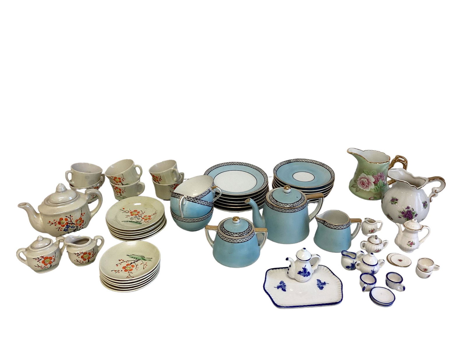 Box lot of small (under 4") to miniature (2-1/2" or smaller) tea sets, pitchers. Very small chip in (1 of 1)