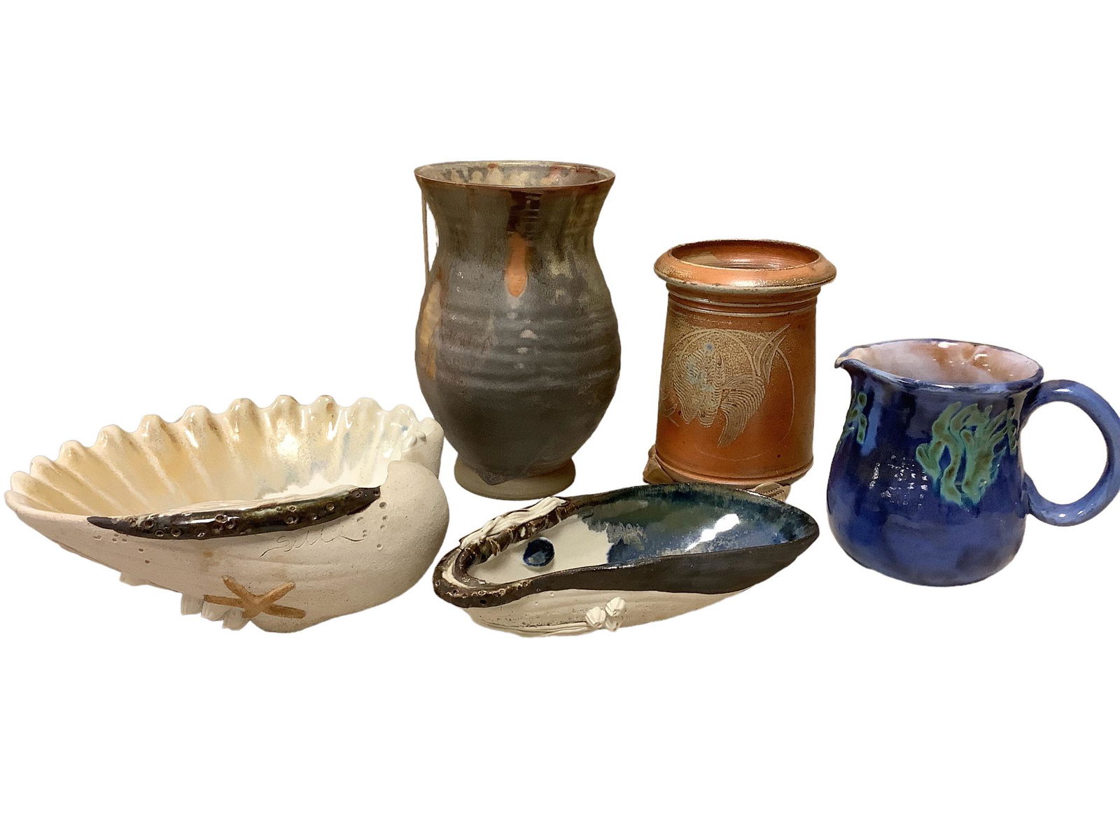 Five pieces of pottery including 2 matching shell motif pieces, a blue pitcher from Barbados, an (1 of 2)