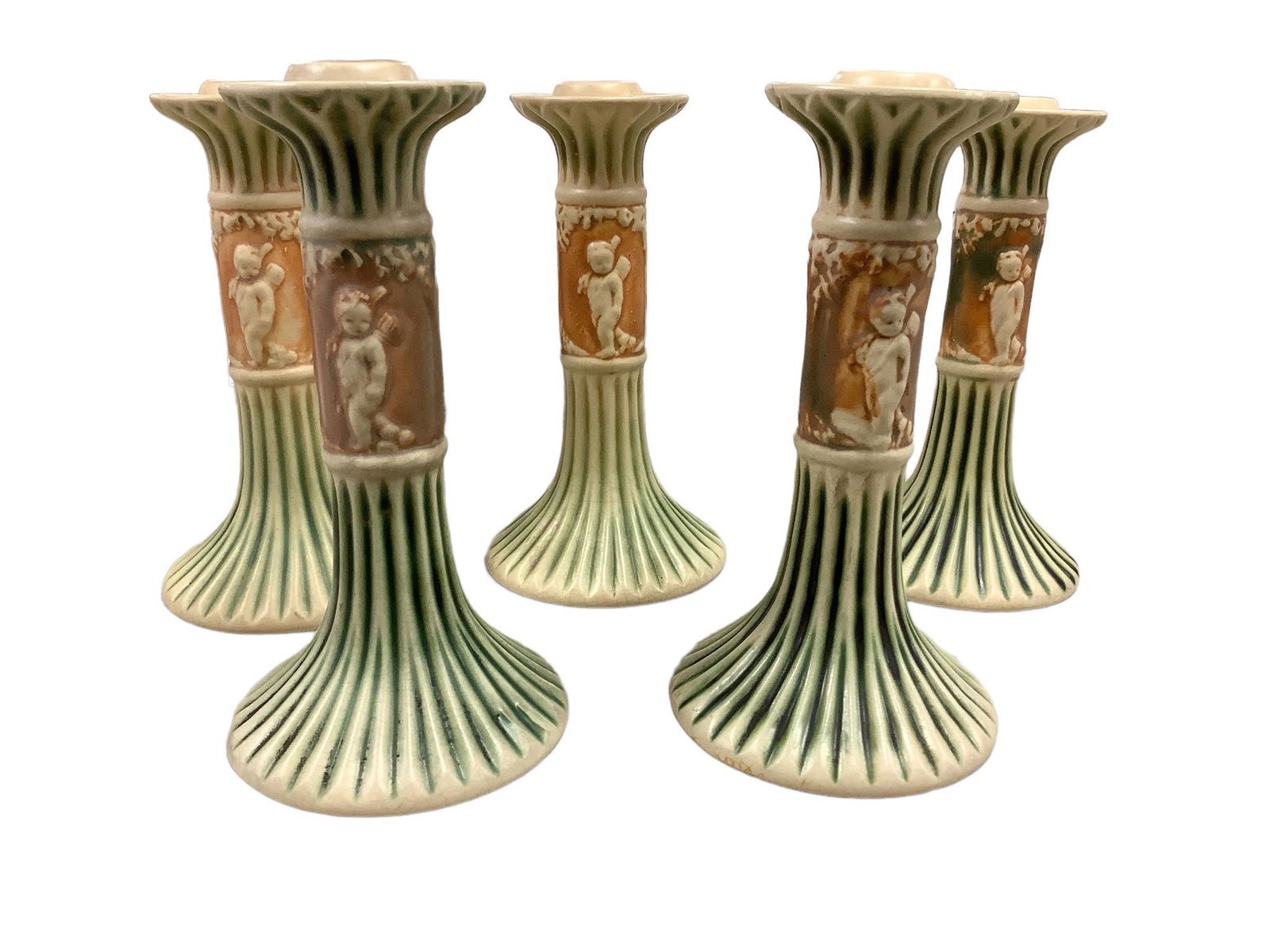 Roseville Donatello pattern of cherubs amidst the trees. Cream/Green/Tan. Lot of 5 candlesticks. (1 of 3)