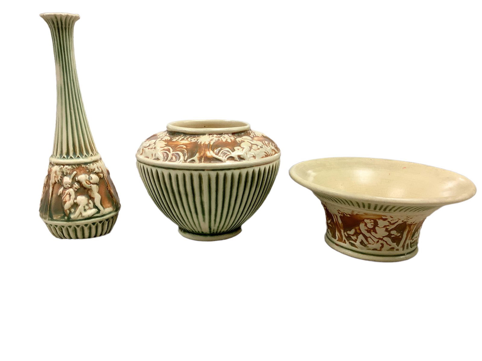 Roseville Donatello pattern of cherubs amidst the trees. Cream/Green/Tan. Lot of three items. The (1 of 3)