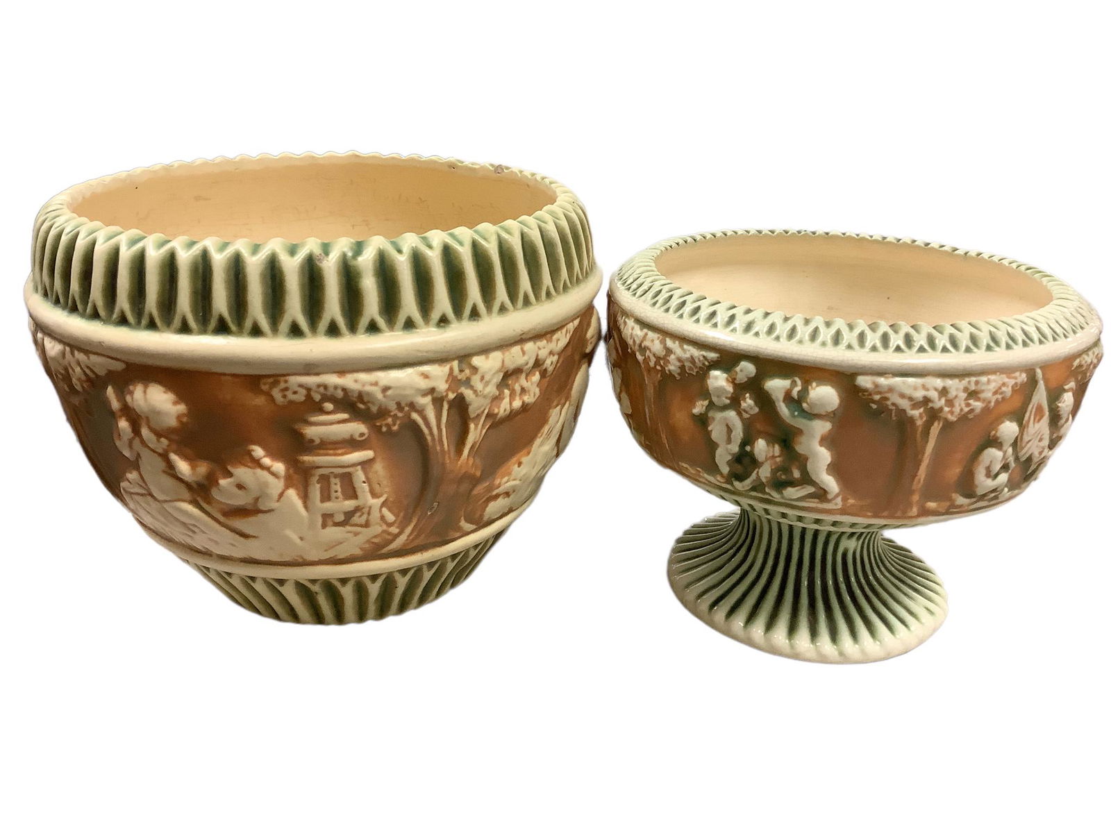 Roseville Donatello, 1 Jardiniere pot measuring 8" diameter, 7" tall. Roseville marking on the: Roseville Donatello, 1 Jardiniere pot measuring 8" diameter, 7" tall. Roseville marking on the bottom. Cream/Green/Tan. 1 footed fern dish bowl measuring 7 1/2" diameter, 6" tall. No marking. Cream/Gr