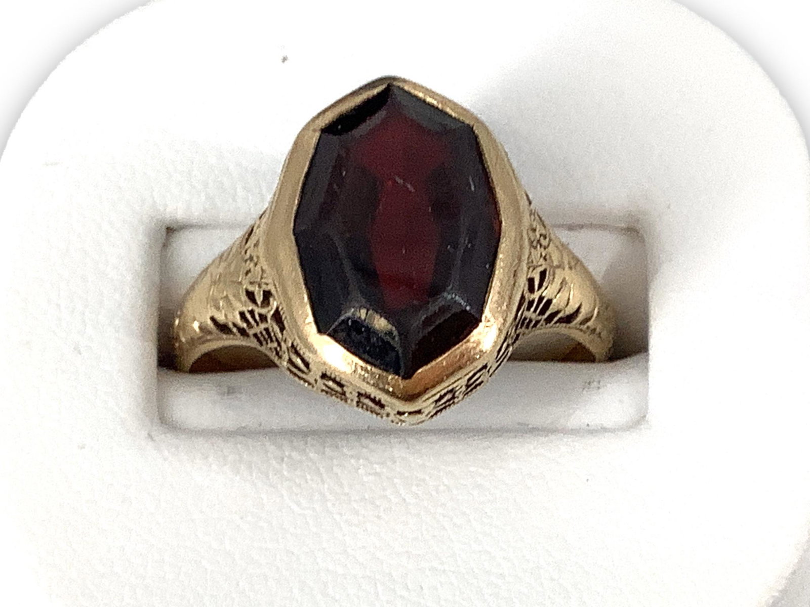 Antique Gold and Garnet Ring: Antique Gold and Garnet Ring No stamps/signatures, size 9.5 with decorative shank with worn natural design, 2.5 dwt., filigree ring design with shank and mounting perforations, bezel set/fantasy cut g