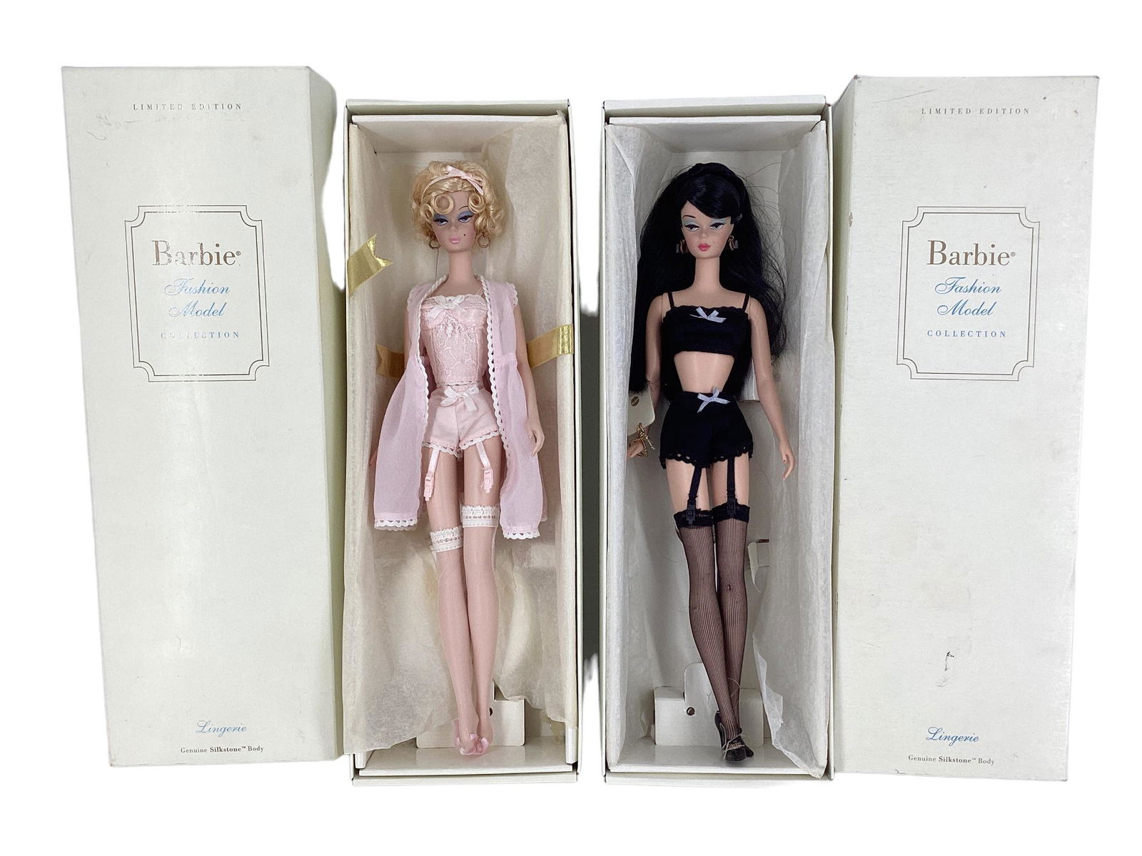 (2) Silkstone Barbies (1) BFMC BLOND LINGERIE BARBIE with a genuine Silkstone body.Lingerie Barbie: (2) Silkstone Barbies (1) BFMC BLOND LINGERIE BARBIE with a genuine Silkstone body.Lingerie Barbie is wearing an intricate pale pink lace accents this heavenly bustier ensemble. Her hair is short curl