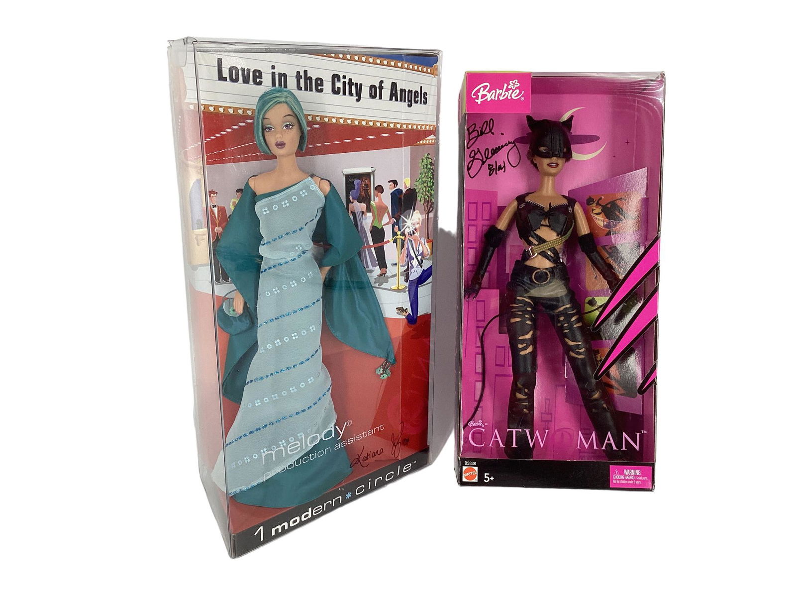 (2) Barbies signed by two designers (1) CATWOMAN BARBIE, a doll designed after Halle Berry and is (1 of 2)