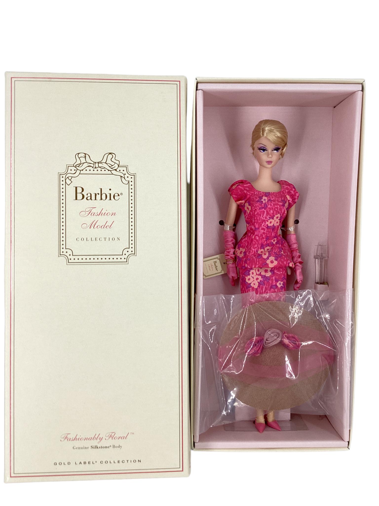 (1) FASHIONABLY FLORAL SILKSTONE BARBIE. A gorgeous doll from the BFMC that has a gold label with no: (1) FASHIONABLY FLORAL SILKSTONE BARBIE. A gorgeous doll from the BFMC that has a gold label with no more than 10,000 worldwide. Barbie is wearing a slim pencil skirt topped off by a peplum blouse wit