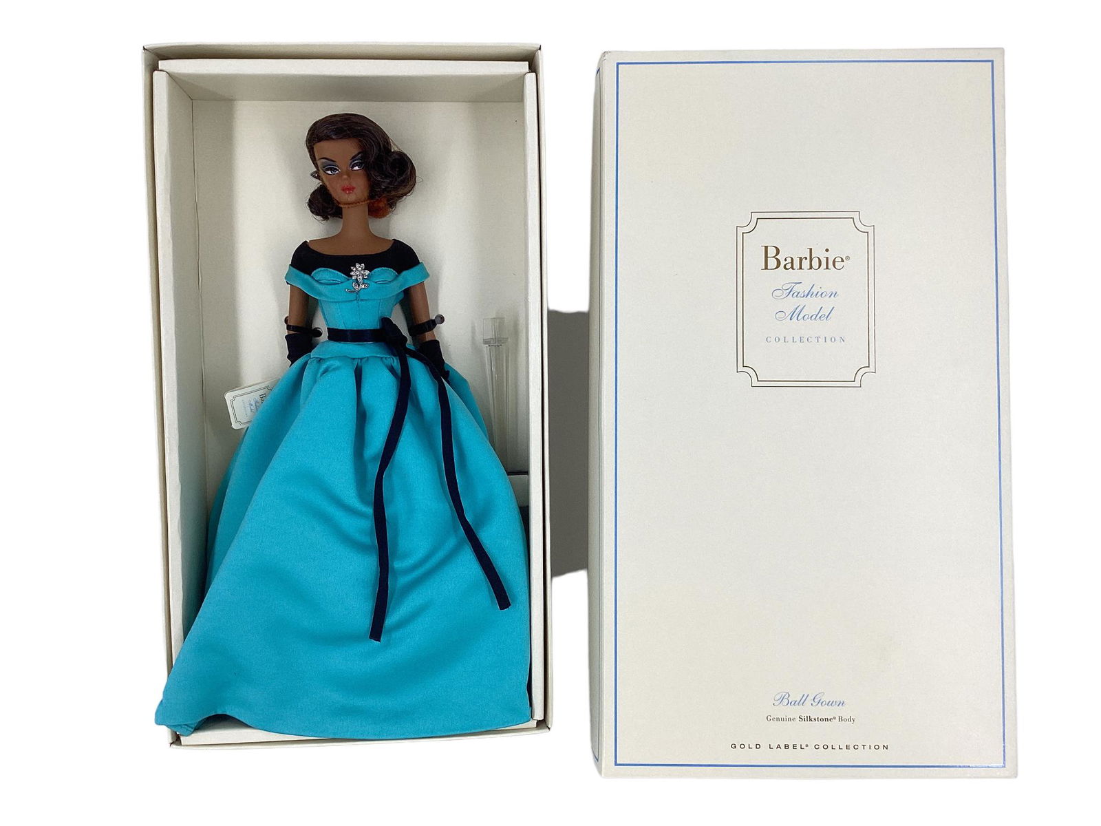 BFMC BALL GOWN AA BARBIE WITH GENUINE SILKSTONE BODY. Barbie wears a turquoise and black tulle under: BFMC BALL GOWN AA BARBIE WITH GENUINE SILKSTONE BODY. Barbie wears a turquoise and black tulle under the dress & black under top gown with a floral brooch and black ribbon for a belt, black opera glov