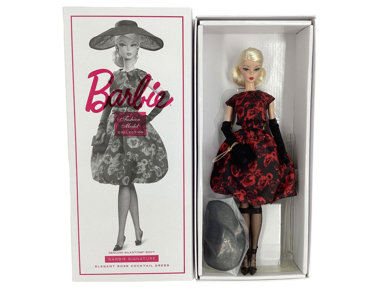 BARBIE FASHION MODEL COLLECTION ELEGANT ROSE DRESS w/ genuine Silkstone Body and a BARBIE SIGNATURE: BARBIE FASHION MODEL COLLECTION ELEGANT ROSE DRESS w/ genuine Silkstone Body and a BARBIE SIGNATURE SERIES. Barbie models this chic 2- piece outfit featuring a bold red rose pattern printed on taffeta