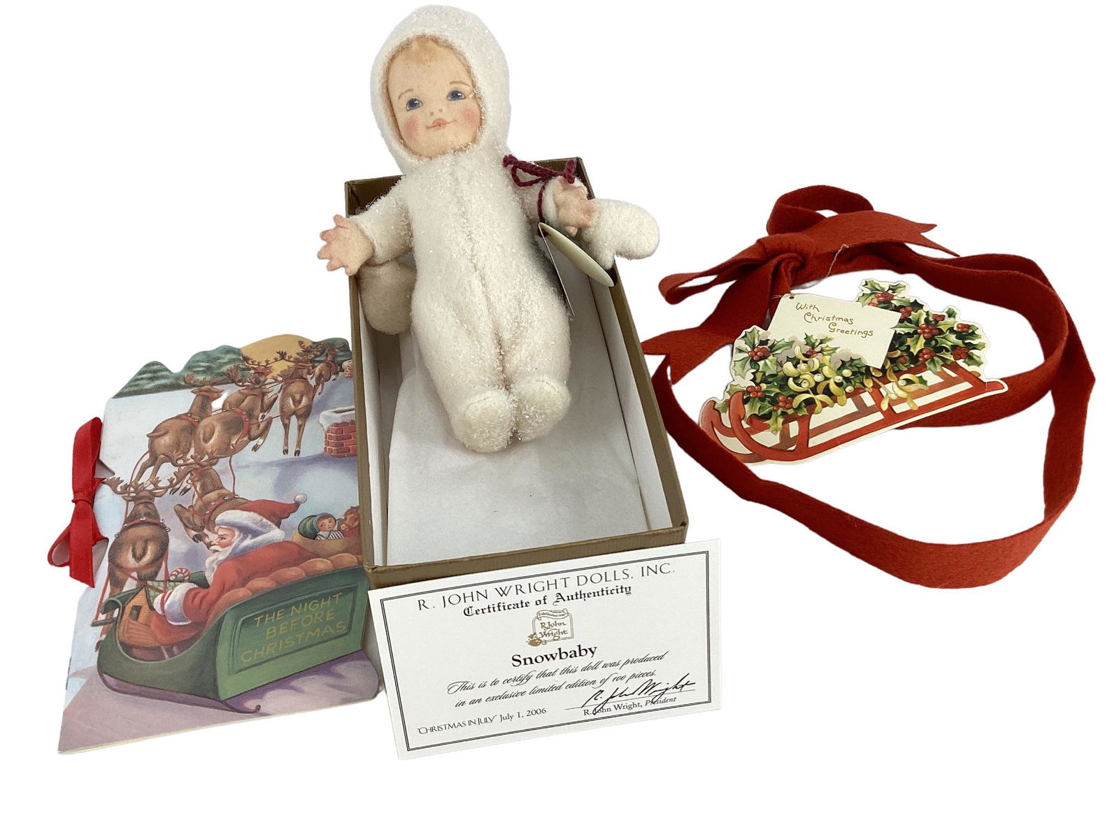 R. John Wright "Snowbaby". 6" doll with molded and painted hair and facial features, dressed in his: R. John Wright "Snowbaby". 6" doll with molded and painted hair and facial features, dressed in his glittery snow suit, hood and mittens. Made for the "Christmas in July 2006" event, limited edition o