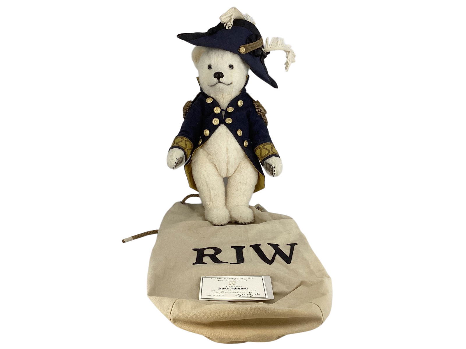 R. John Wright Bear Admiral. Made for the Bears-at-Sea Collection, 24" white alpaca bear with glass: R. John Wright Bear Admiral. Made for the Bears-at-Sea Collection, 24" white alpaca bear with glass eyes, leather nose, resin claws, disk jointed head, arms and legs, felt paw pads. Bear Admiral is dr