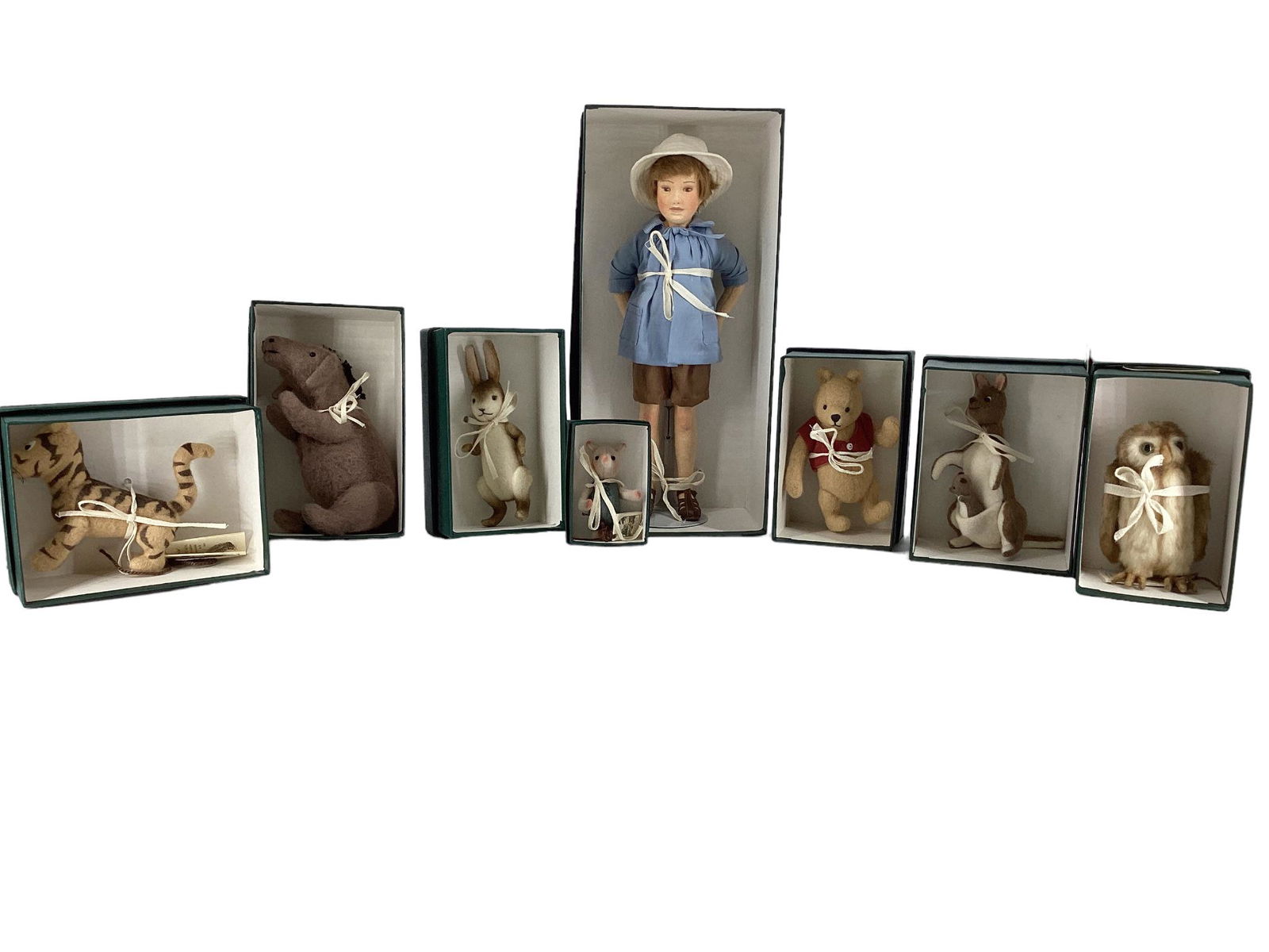 R. John Wright all wool felt Winnie-the-Pooh Pocket Series. Includes 12" Christopher Robin with: R. John Wright all wool felt Winnie-the-Pooh Pocket Series. Includes 12" Christopher Robin with mohair wig, molded and painted facial features, five-piece body with disk jointed arms and legs; Winnie-