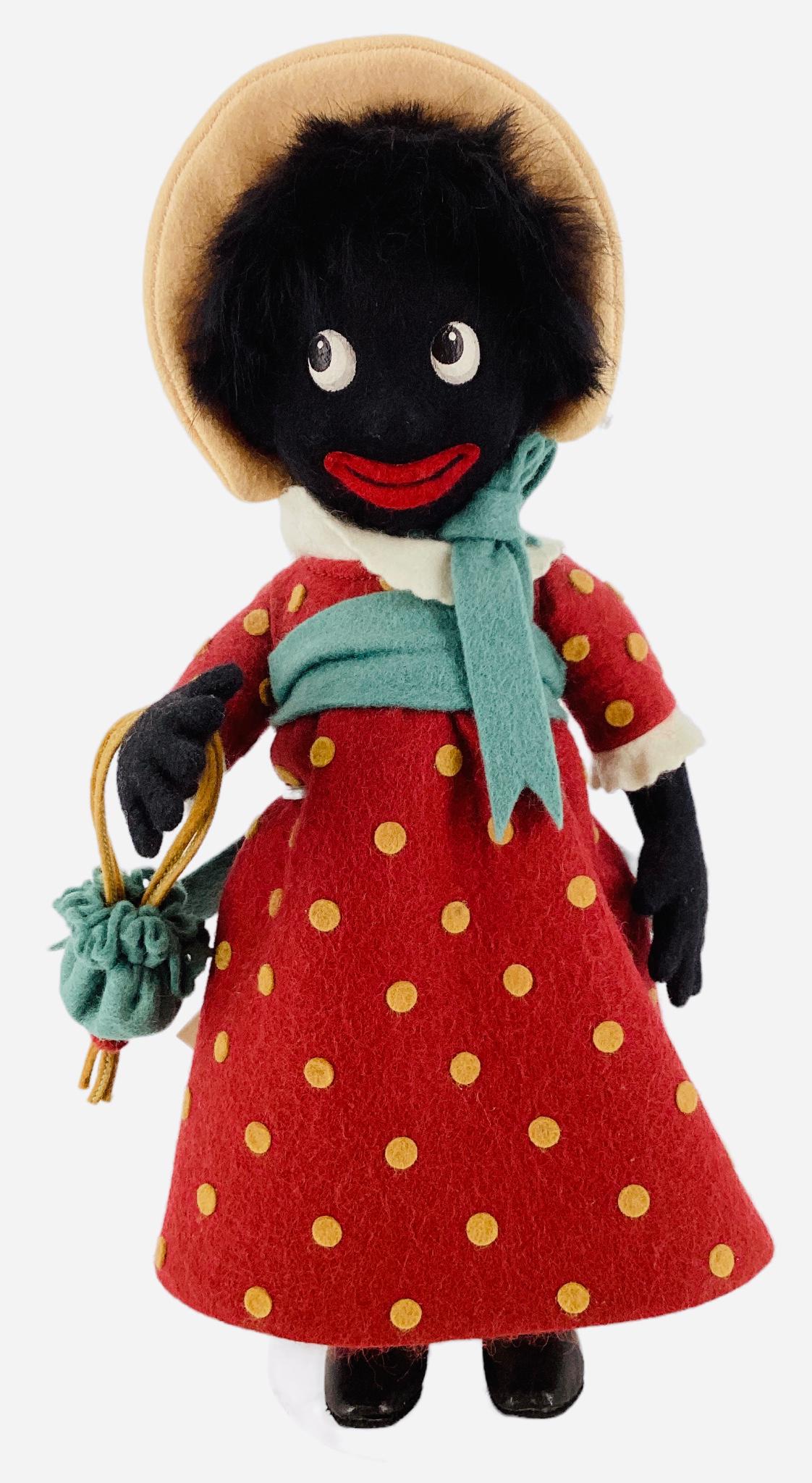 R. John Wright 1997 doll, based on Florence Upton character, 9" wearing red felt dress with yellow: R. John Wright 1997 doll, based on Florence Upton character, 9" wearing red felt dress with yellow dots, comes with original box and COA. Limited edition No. 0680/2500.