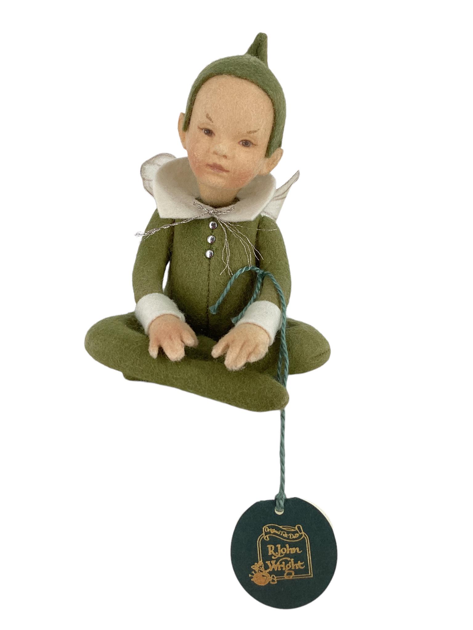 R. John Wright 2016 A Time To Remember Periwinkle is 5" tall, seated figure made of felt with: R. John Wright 2016 A Time To Remember Periwinkle is 5" tall, seated figure made of felt with handpainted features, jointed at the shoulders and neck with ball & socket joint, silk organza wings. Come