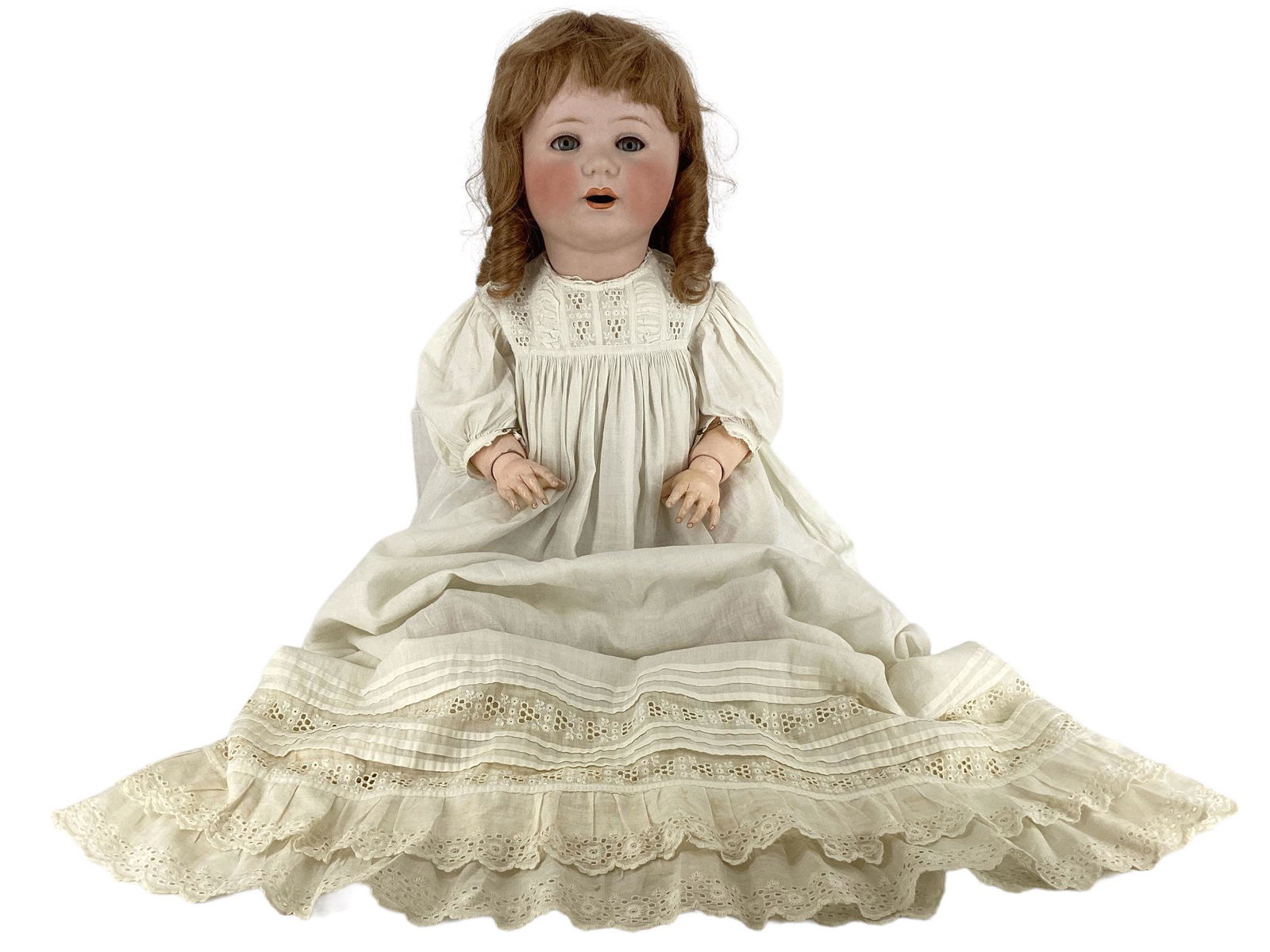 Jutta 1914 bisque socket head character baby. 26" doll with replaced wig, glass sleep eyes with: Jutta 1914 bisque socket head character baby. 26" doll with replaced wig, glass sleep eyes with eyelashes, open mouth (teeth missing), on composition bent limb baby body with jointed wrists. Glue resi