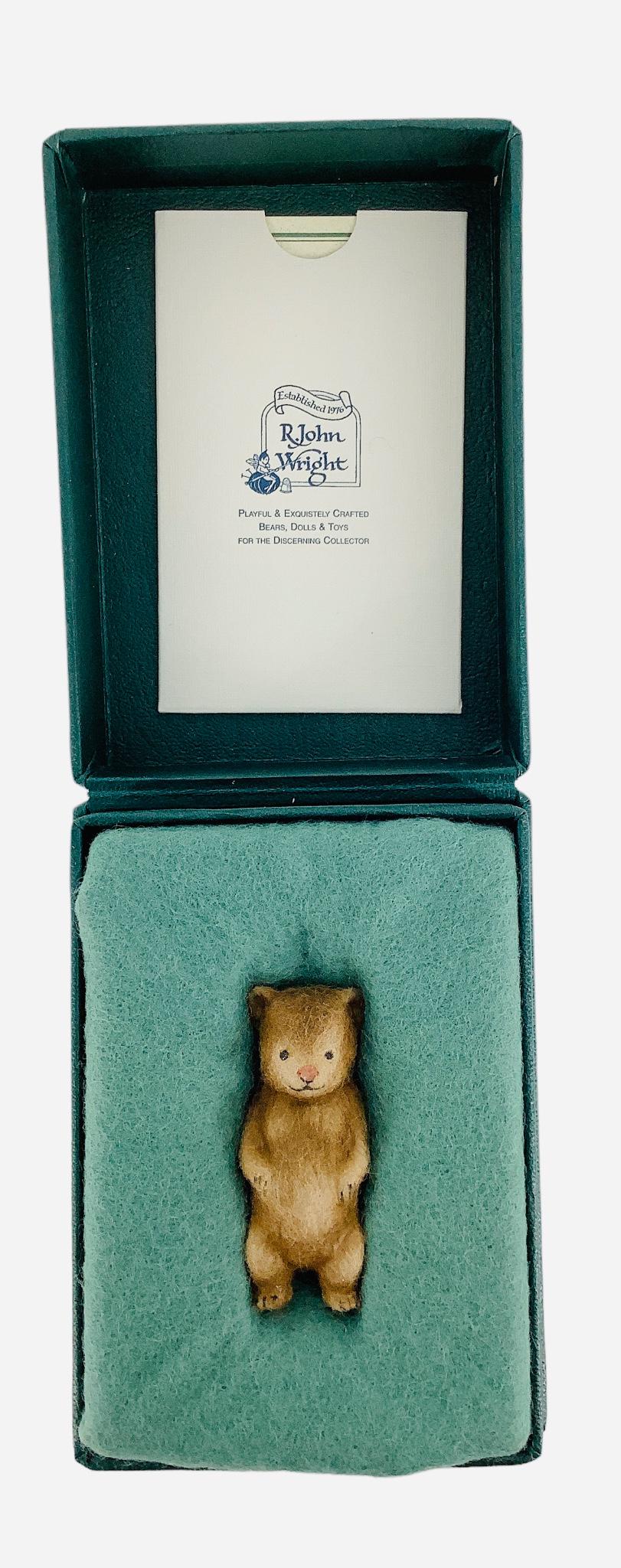 R. John Wright Bear Boutonniere. 1 7/8" one-piece molded bear. Made exclusively for Charter Members: R. John Wright Bear Boutonniere. 1 7/8" one-piece molded bear. Made exclusively for Charter Members of the R. John Wright Collector Club, Edition No.79. Comes in original box with COA.