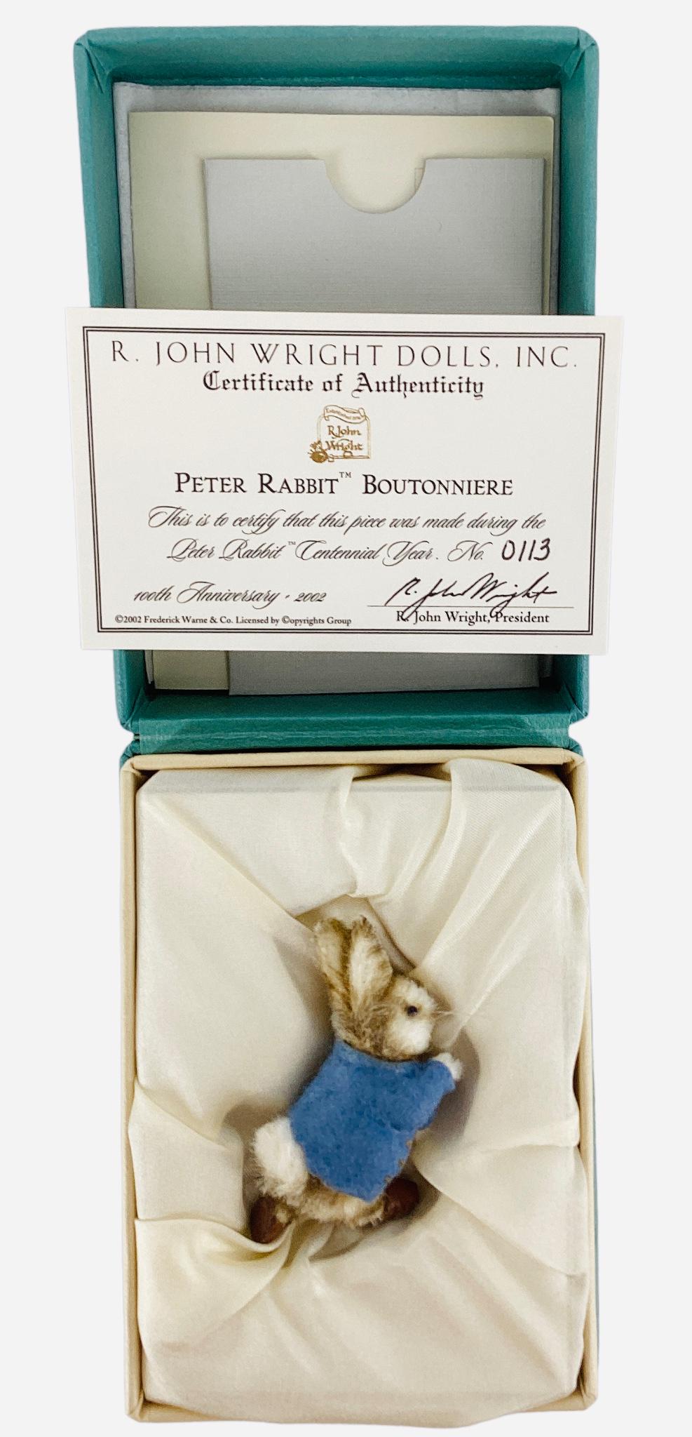 R. John Wright Peter Rabbit Boutonniere. 1 7/8" one-piece molded mohair rabbit made during the Peter: R. John Wright Peter Rabbit Boutonniere. 1 7/8" one-piece molded mohair rabbit made during the Peter Rabbit Centennial Year. Limited Edition No. 113.