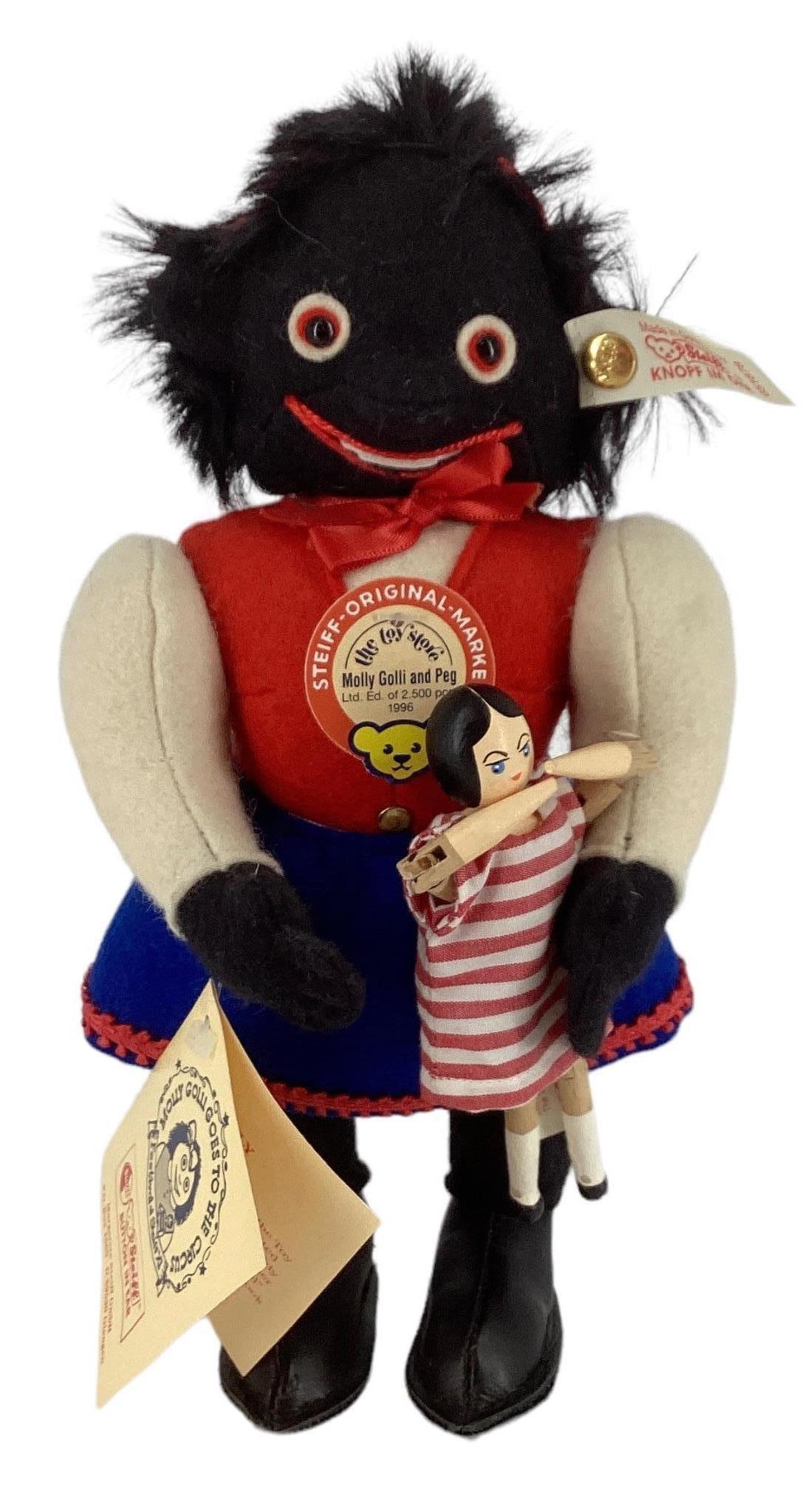 Steiff 9" doll holding wooden doll. Doll is the only girl doll made by the illustrious Margarete (1 of 2)