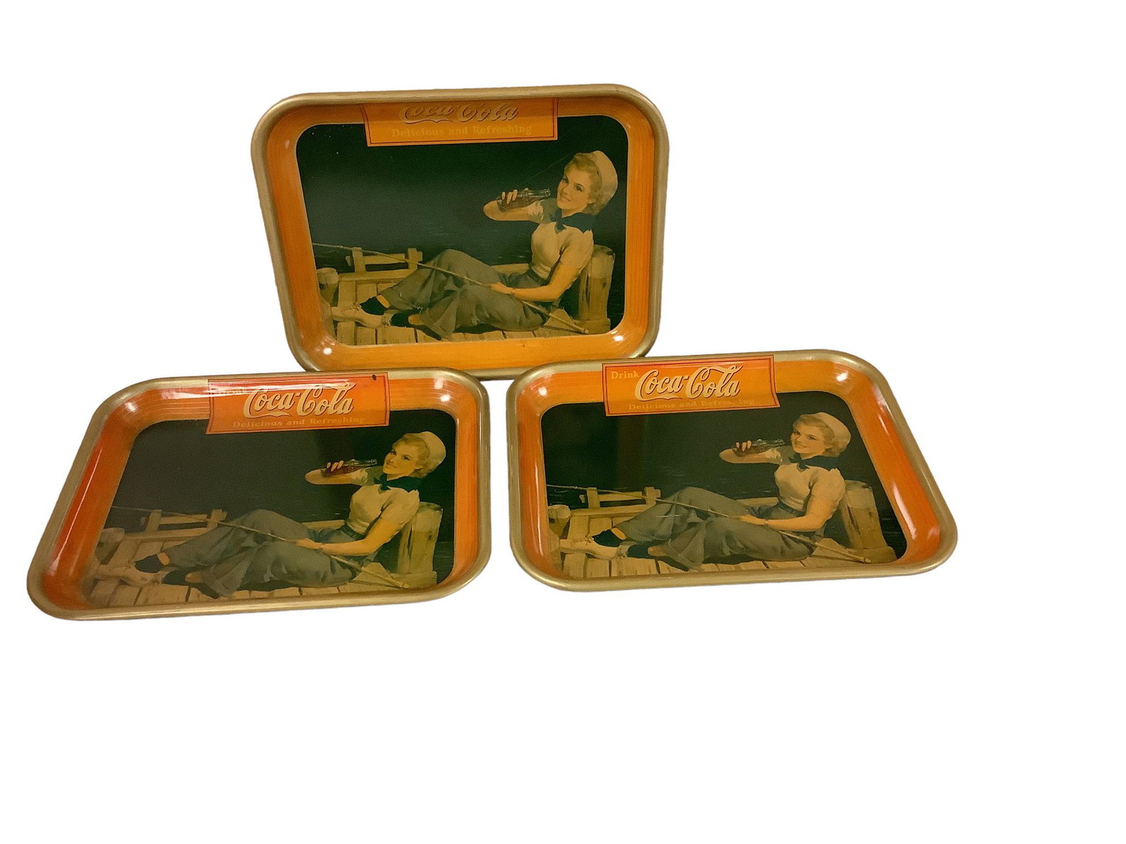 Lot of three Coca Cola trays by American Art Works Coshocton, OH., circa 1940, 10.5”H x (1 of 2)