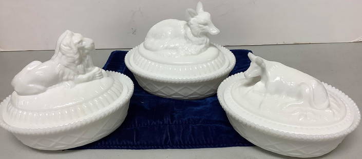 Lot of 3 larger milk glass covered dishes @ approx 7 1/2” long and with a fox, cow and lion: Lot of 3 larger milk glass covered dishes, approx. 7 1/2” long and with a fox, cow and lion motif. Dishes are marked with a “K” on the bottom, presumably for Kemple works.