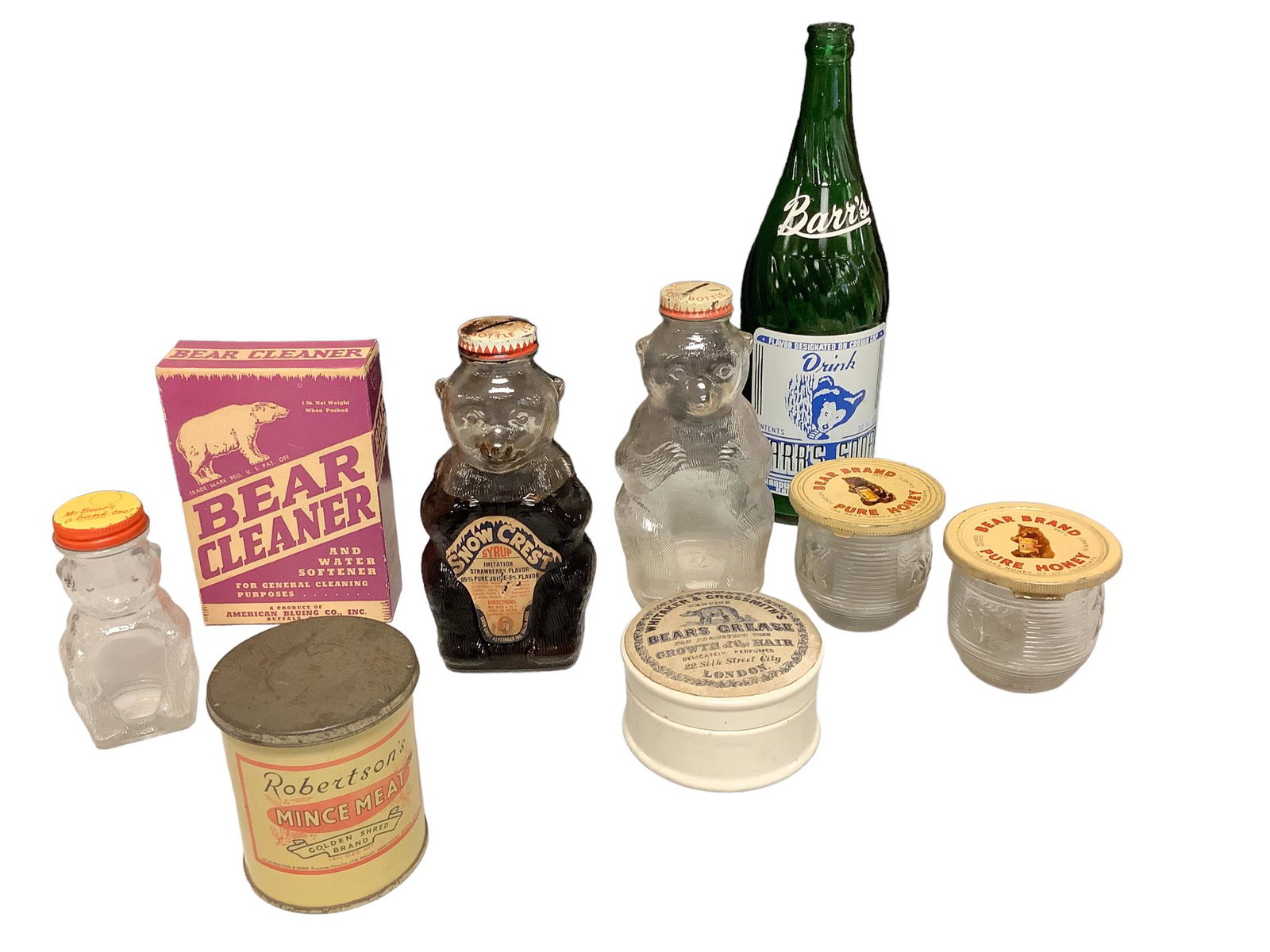 Old advertising displays and products including 2 Snow Crest syrup glass bottles, 2 glass & tin Bear: Old advertising displays and products including 2 Snow Crest syrup glass bottles, 2 glass & tin Bear Brand honey jars, an empty box of Bear Cleaner from Buffalo, NY, a Barr’s empty soda bottle,