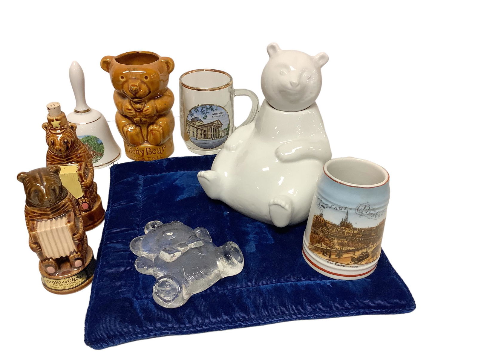 Lot of 8 bear-themed glass items including a white bank shaped as a bear, a clear glass hanging bear: Lot of 8 bear-themed glass items including a white bank shaped as a bear, a clear glass hanging bear ornament, 2 German souvenir cups, 2 Schwartz of Portugal bear-themed containers, a bell and a ceram