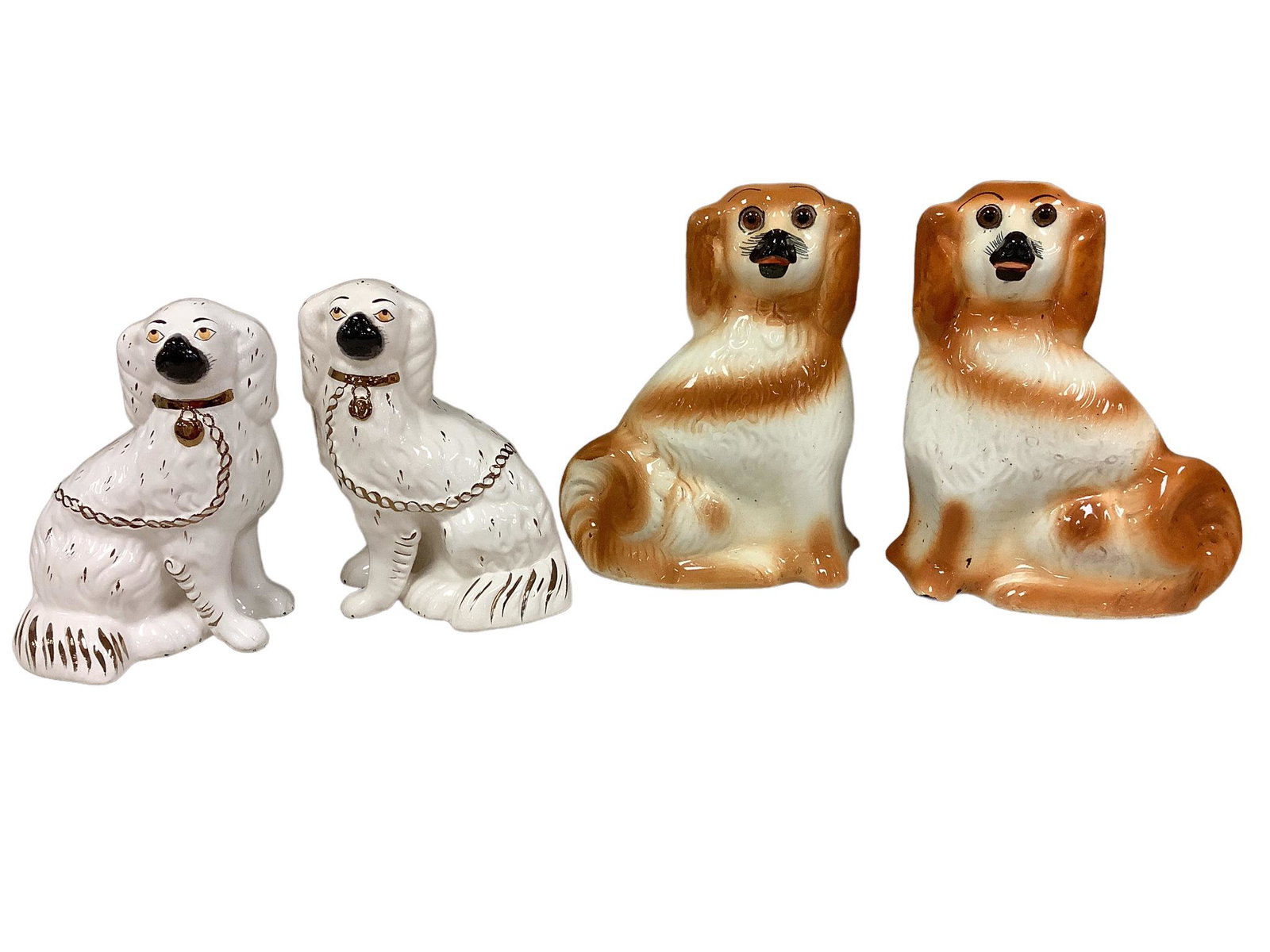 Lot of two pair of unmarked, possibly Staffordshire, dogs. The small pair are each 8.75”h . (1 of 2)