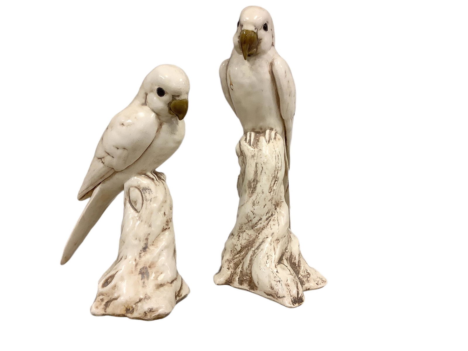 Pair of Freeman & McFarlin potteries parrots, 9.25”h & 11.5”h. Both are signed “ (1 of 3)