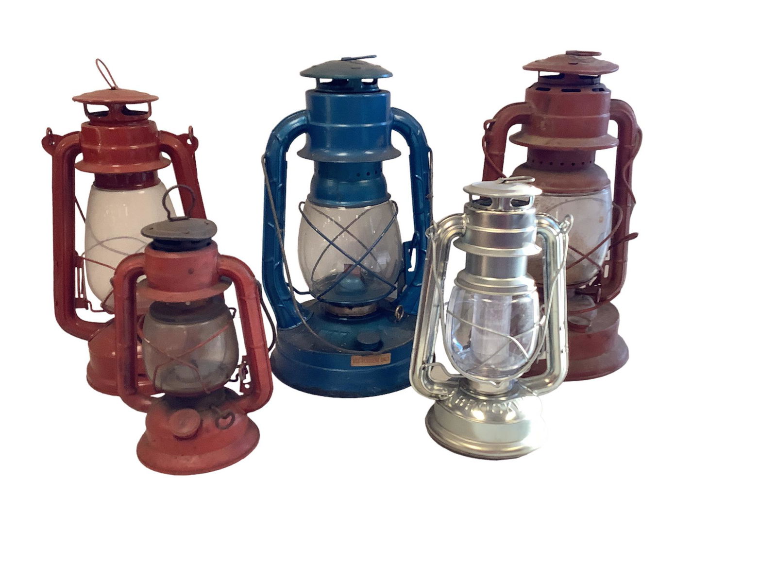 Lot of four oil lanterns and one battery operated lantern, ranging in height from 8” - (1 of 1)