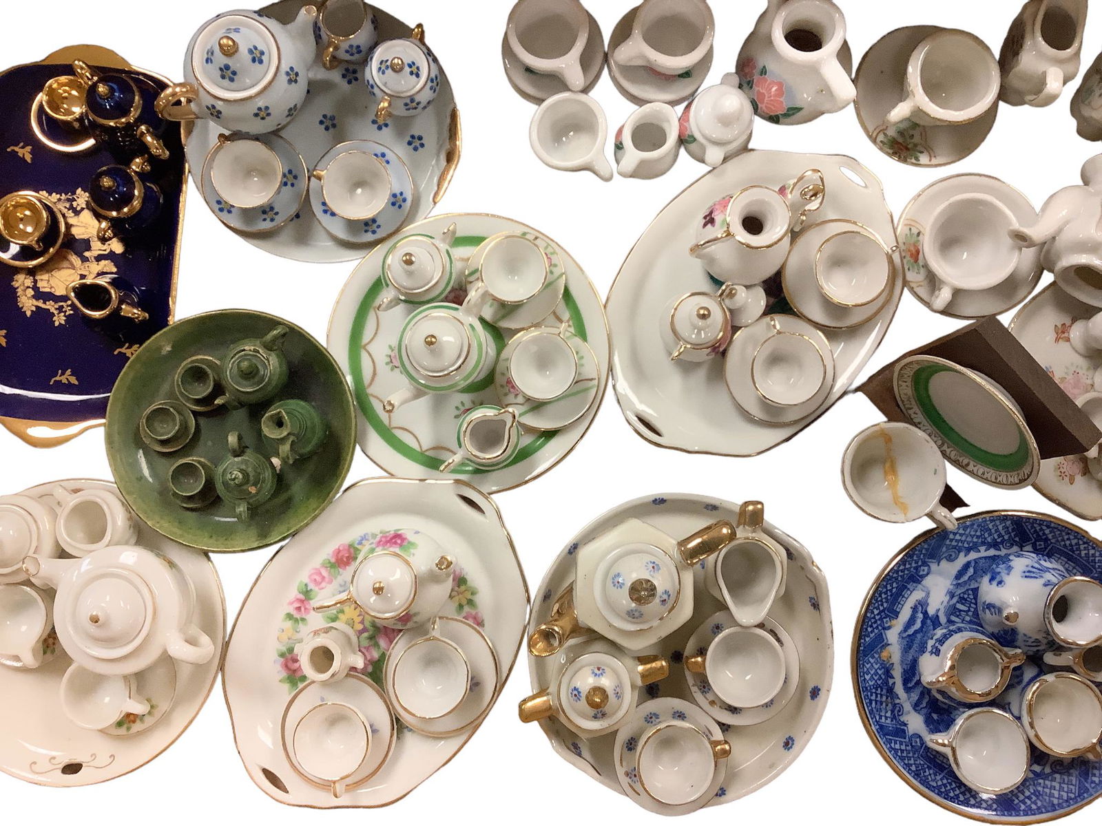 Vintage lot of Miniature sets of tea pots ,trays,cups and saucers (1 of 1)