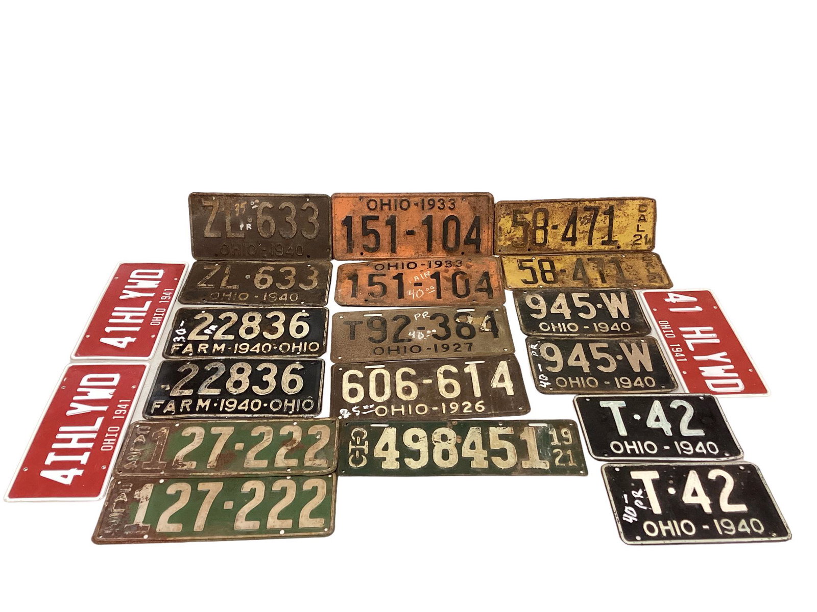 Lot of vintage license plates and 3 reproduction plates. Vintage plates include dates from 1921 to (1 of 1)