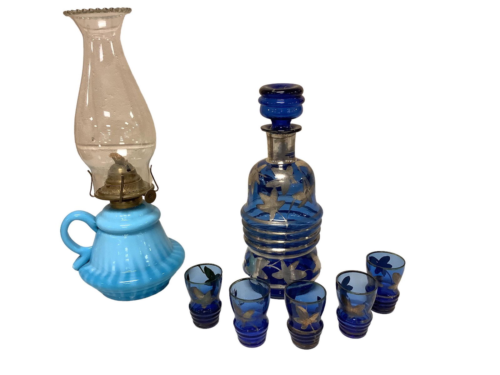Lot including a 12.25”h kerosene lamp with a blue opalescent base and a 9.25”h cobalt (1 of 2)