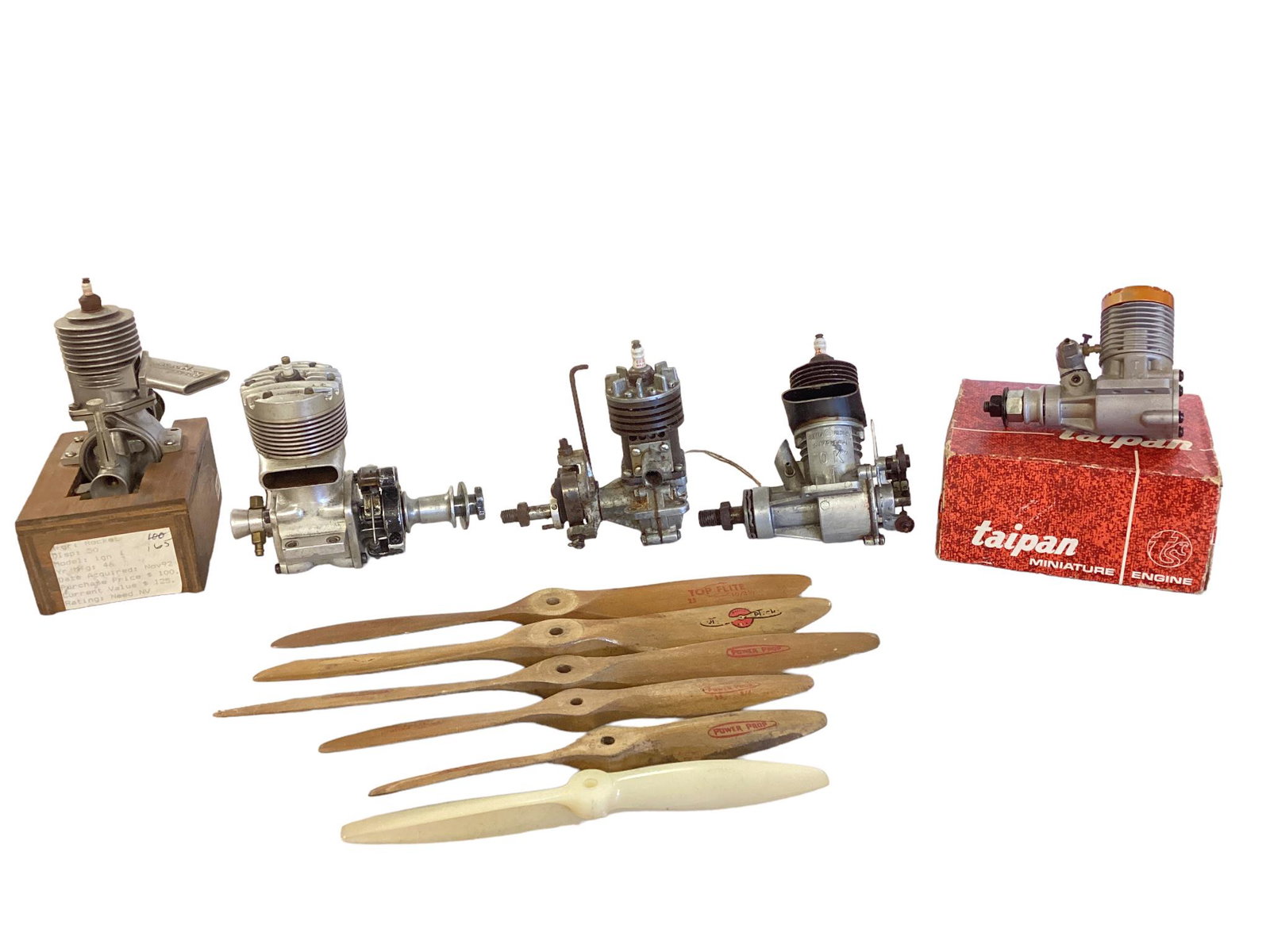 Lot of 5 vintage remote controlled airplane engines and 5 wood propellers and 1 nylon propeller. (1 of 3)